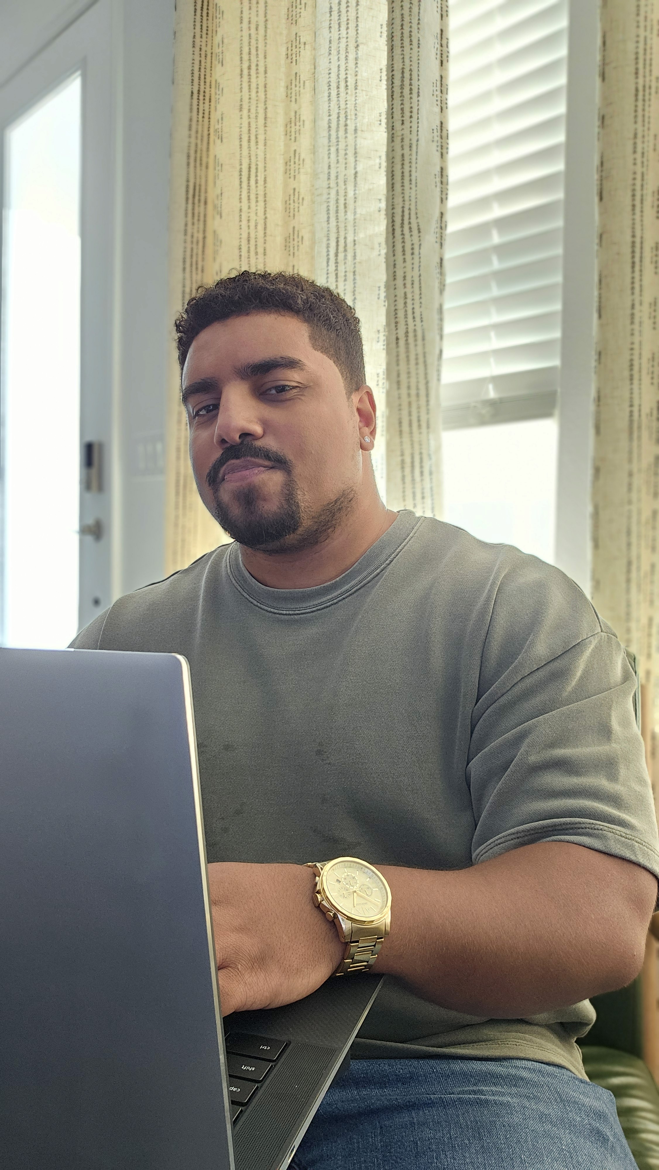 men sitting in front of their laptop computer