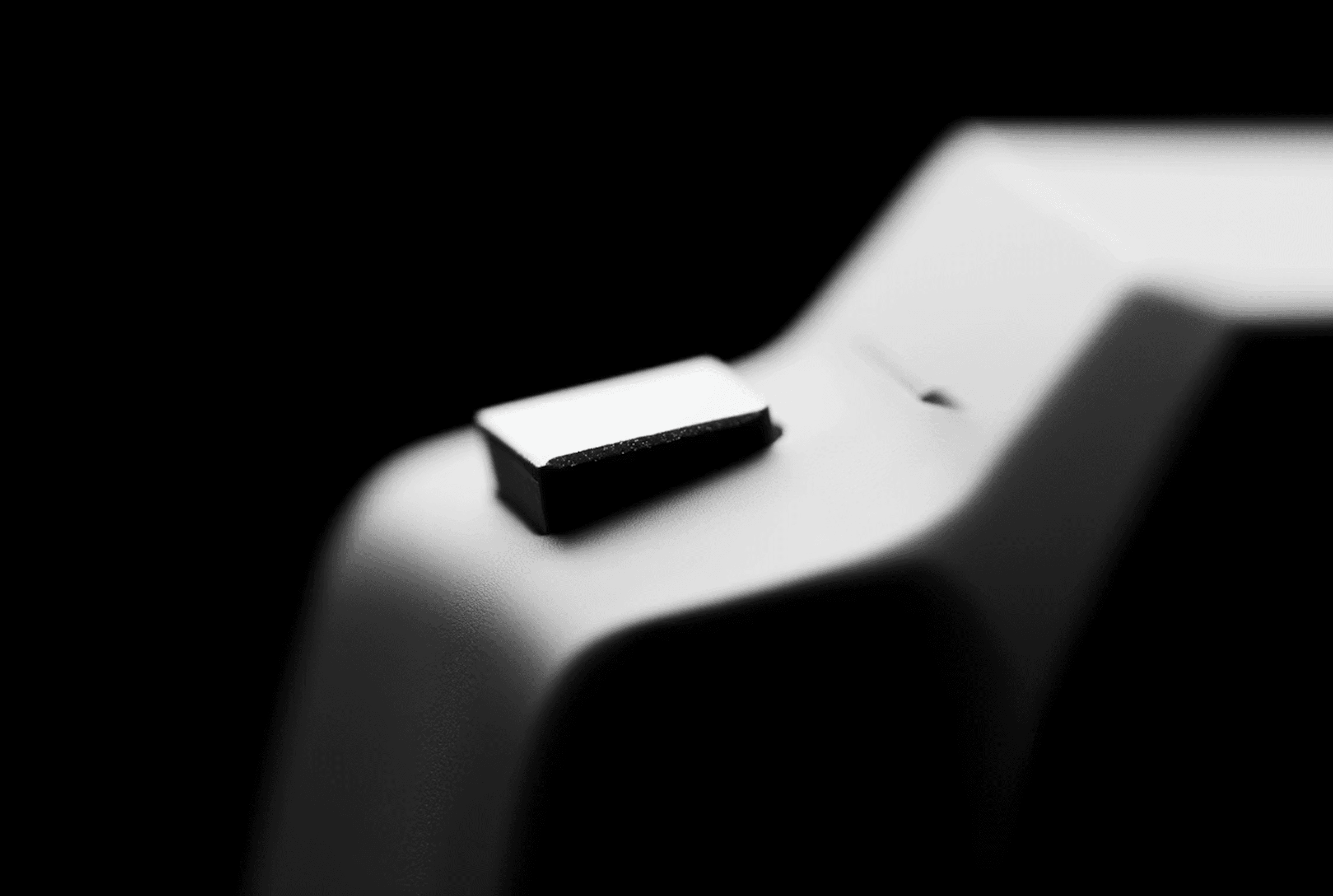 Black-and-white close-up of single keyboard key