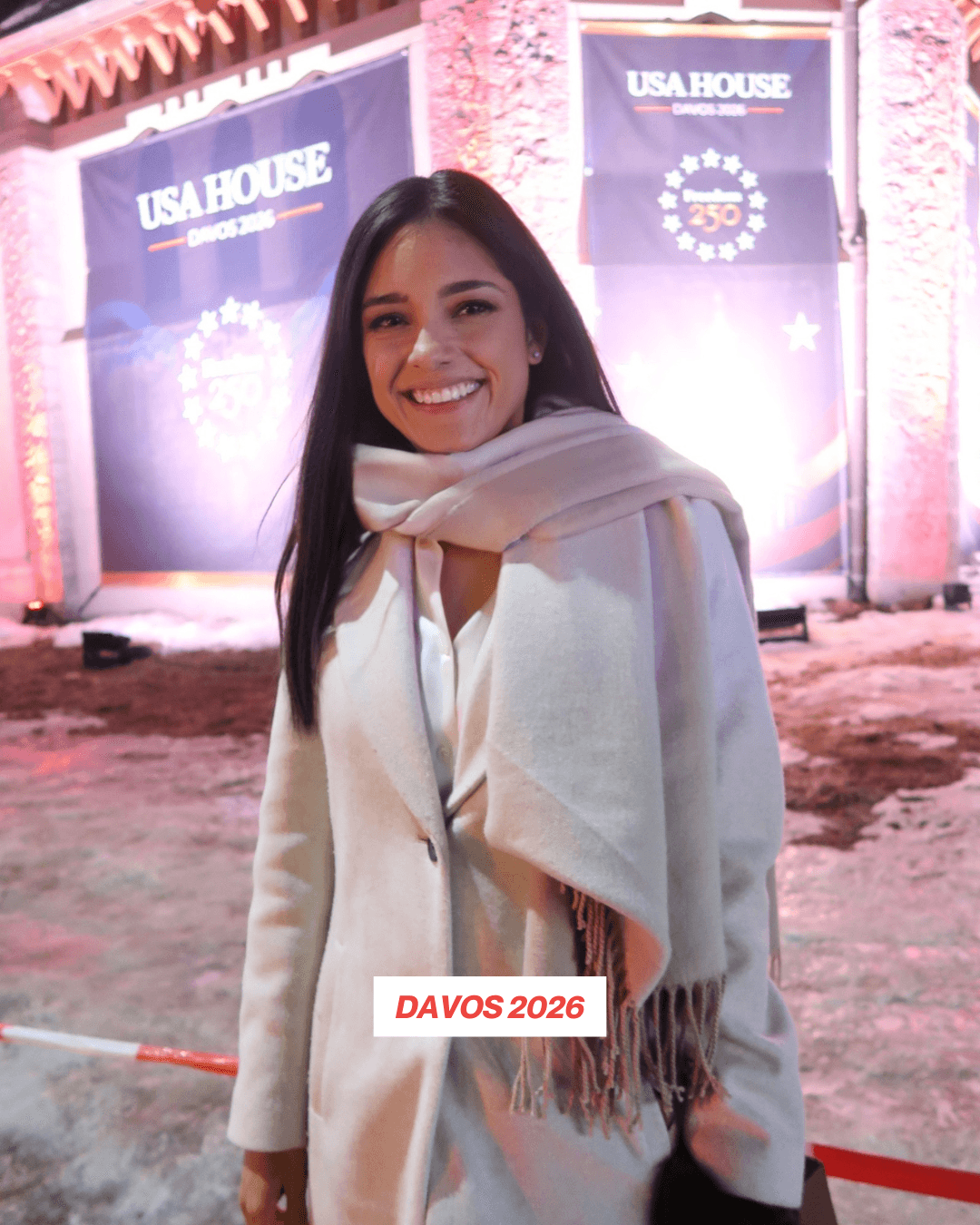 Woman with umbrella walks down rainy city street.