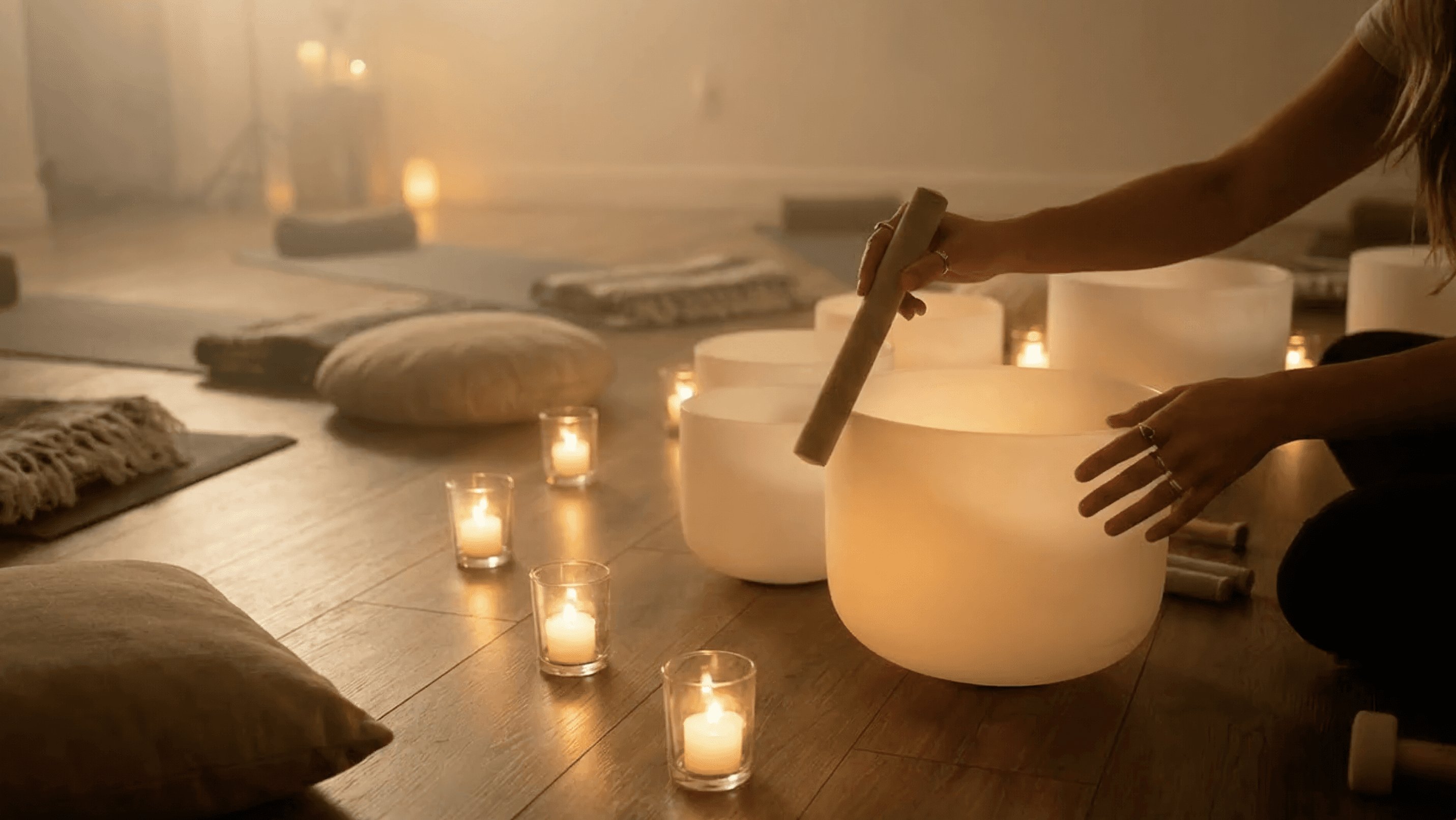 Close-up of a person meditating cross-legged indoors