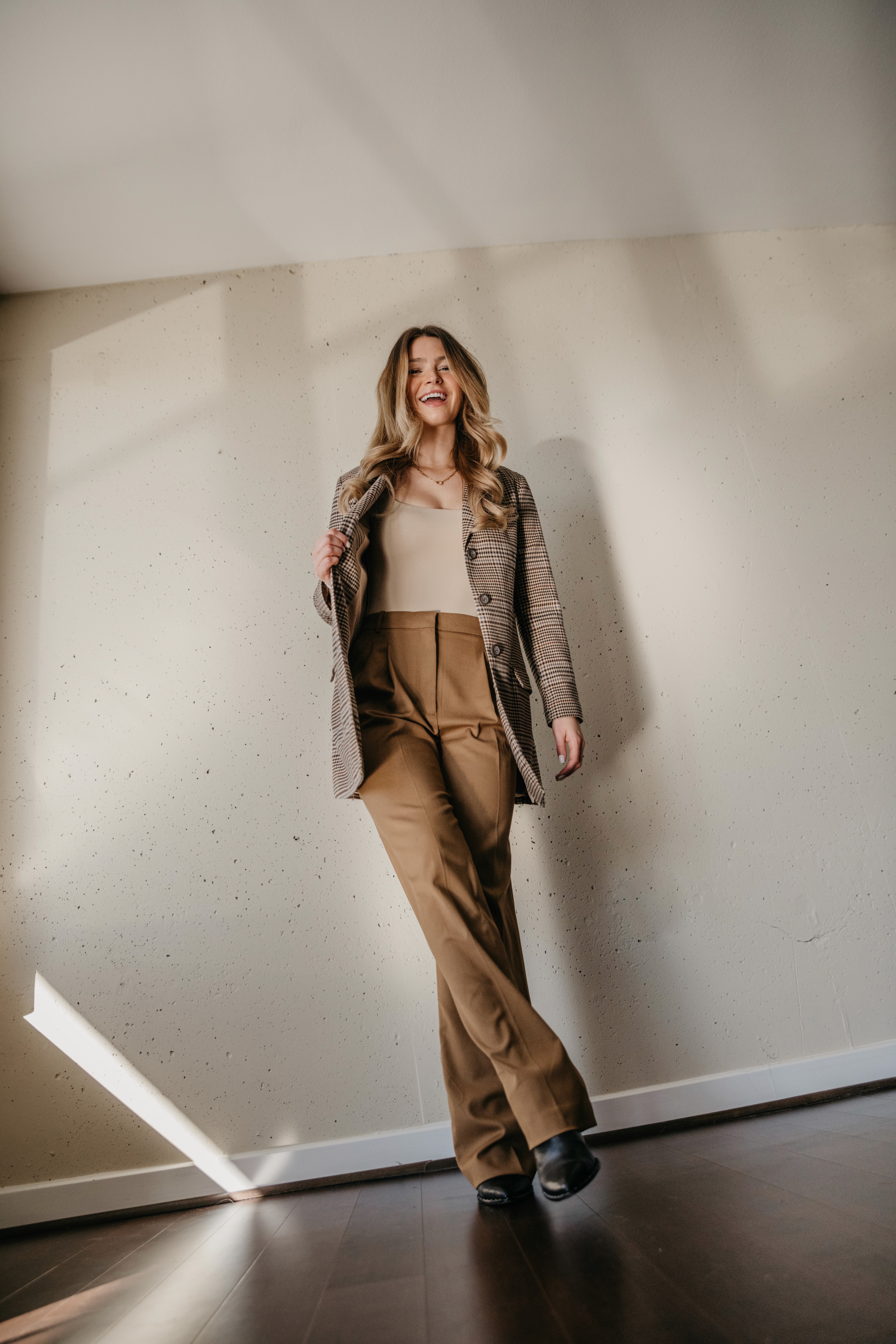 woman kicking in suit