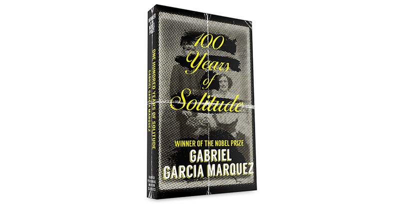 A book with yellow and white writing on the cover, tied with a string.