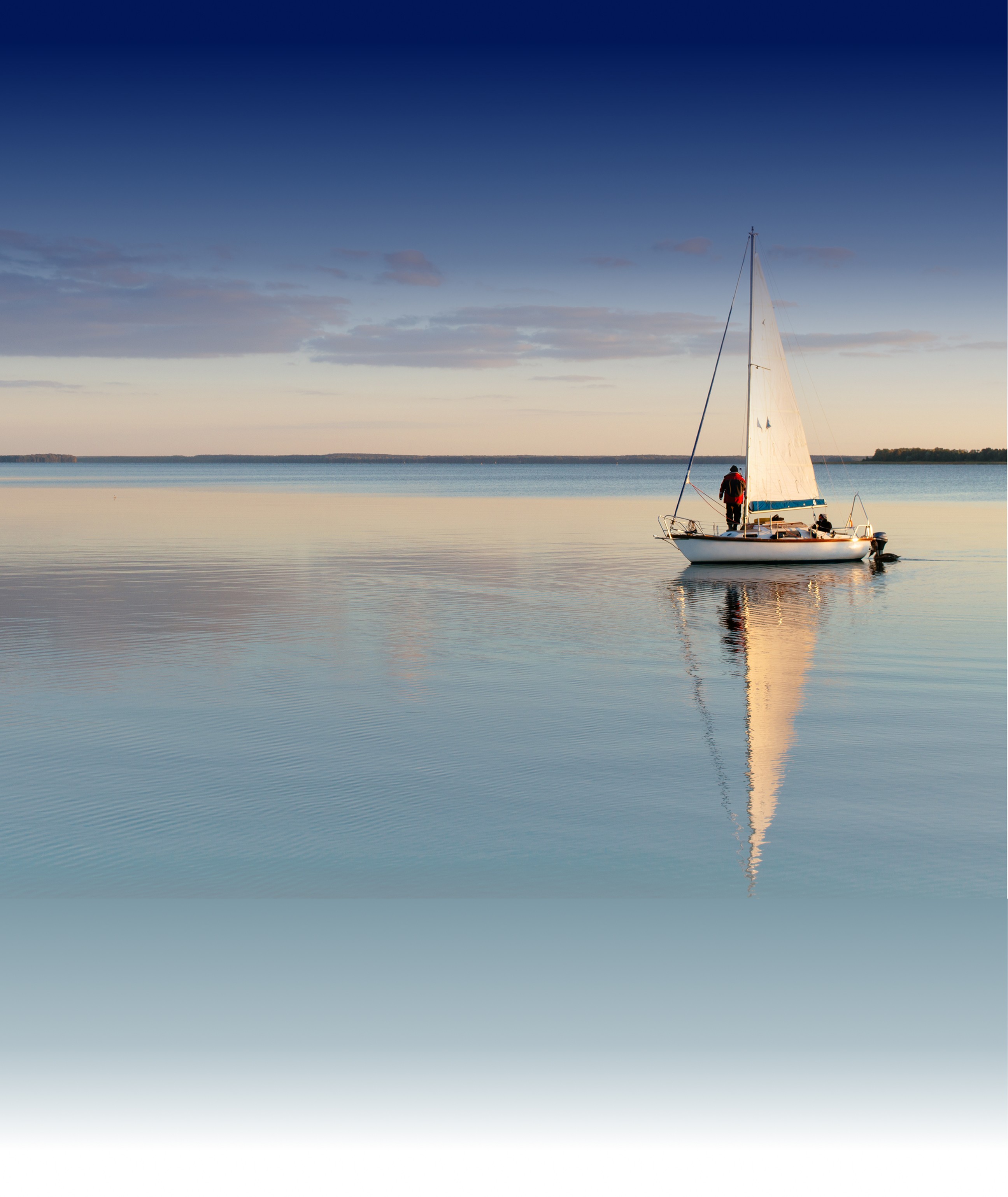 A person sailing their boat on a Swiss Lake