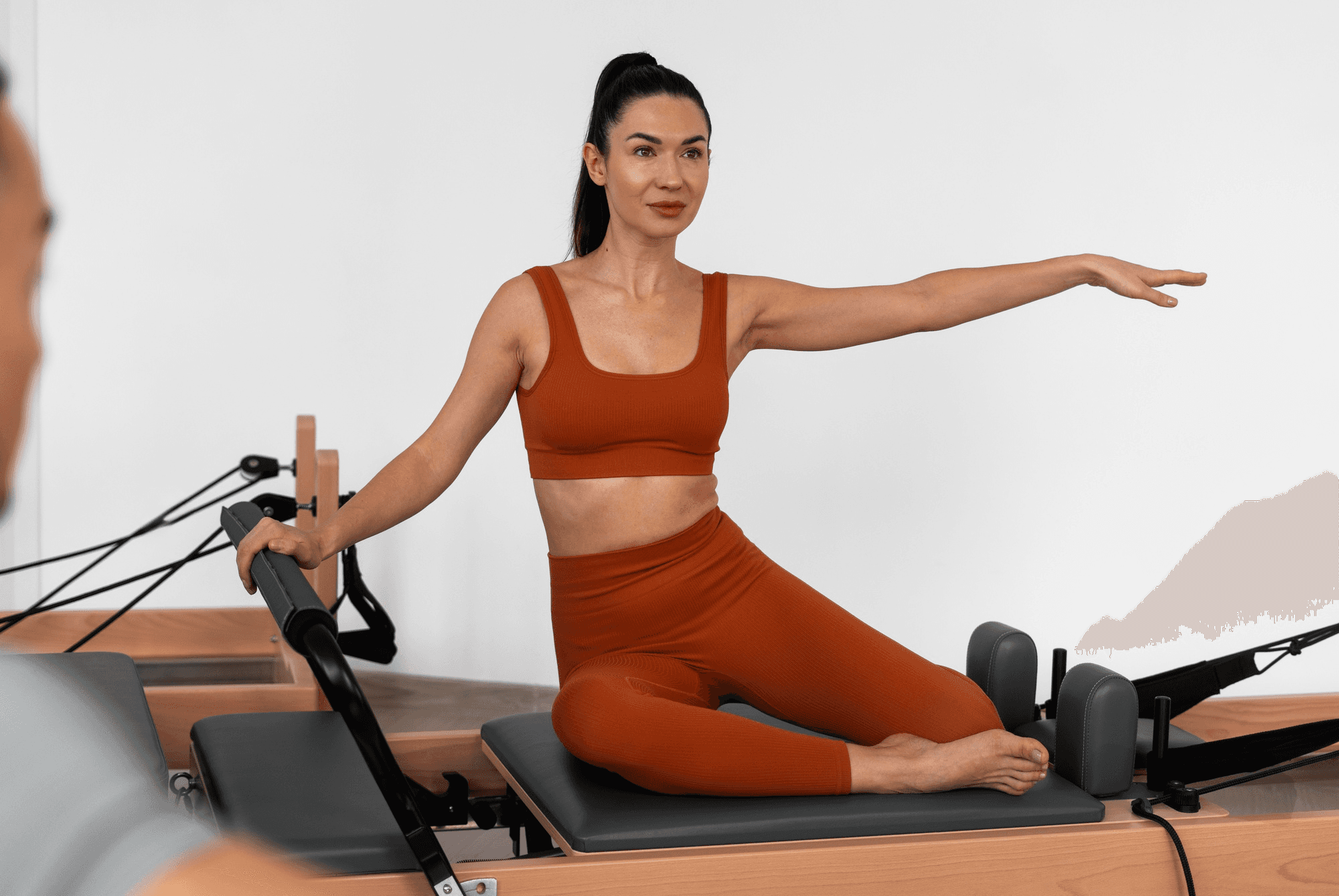 a woman sitting on a piyor in a room