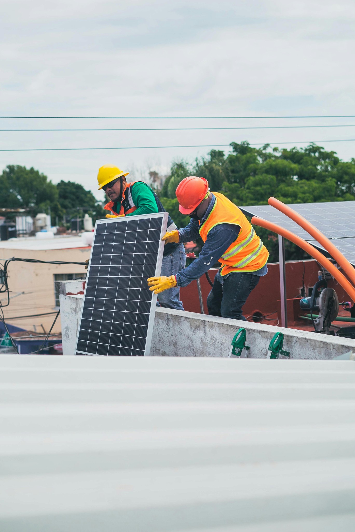 Solar Panel being installed by workers in a home 