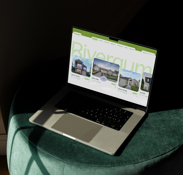 'Don't Tell Mum' website displayed on a laptop sitting in a field of flowers.