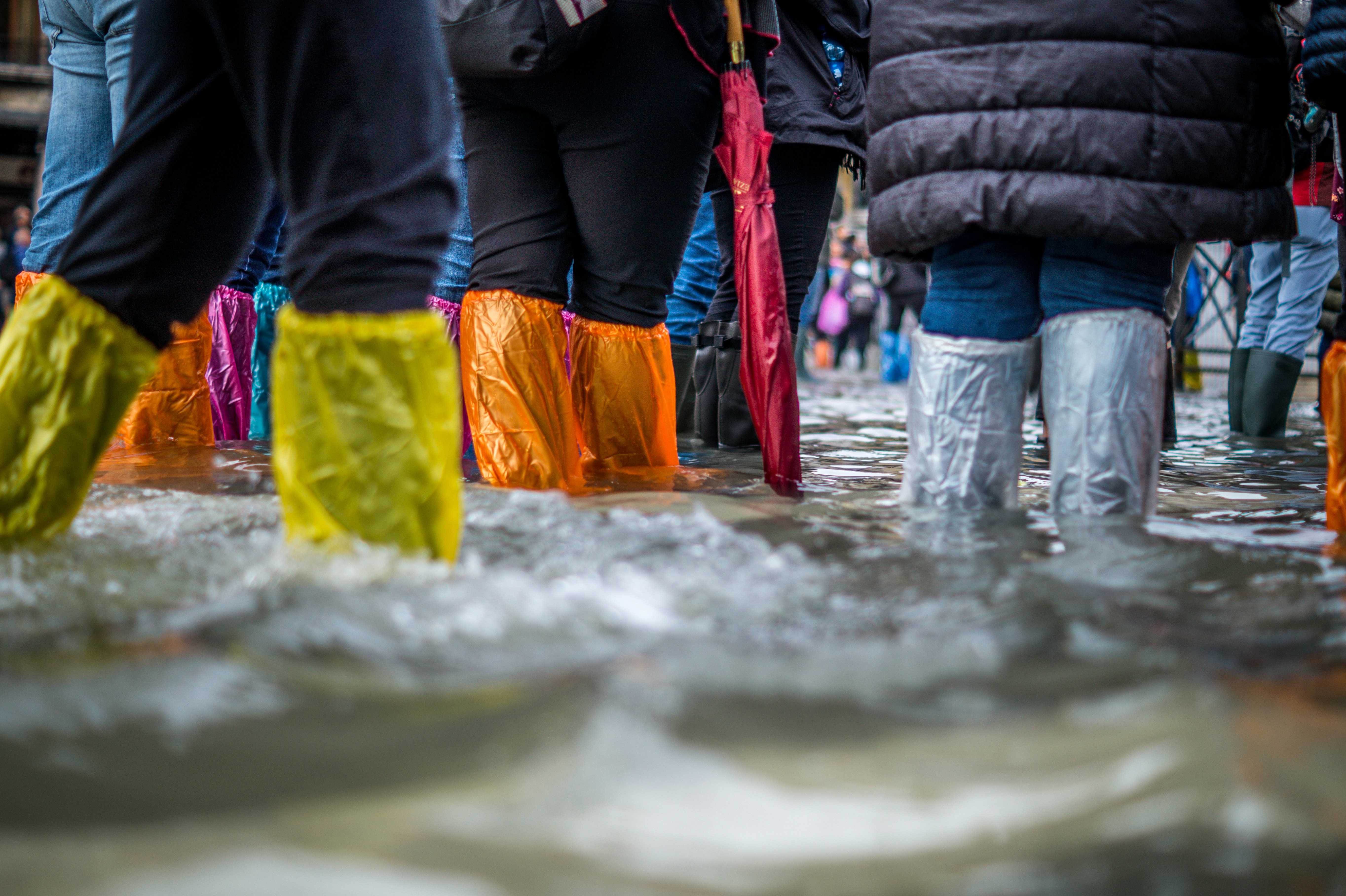 People walking in flooded area