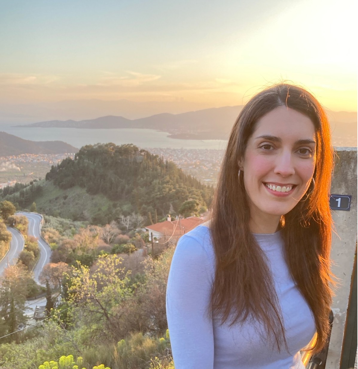 Close up of a woman with eyes closed practicing deep breathing