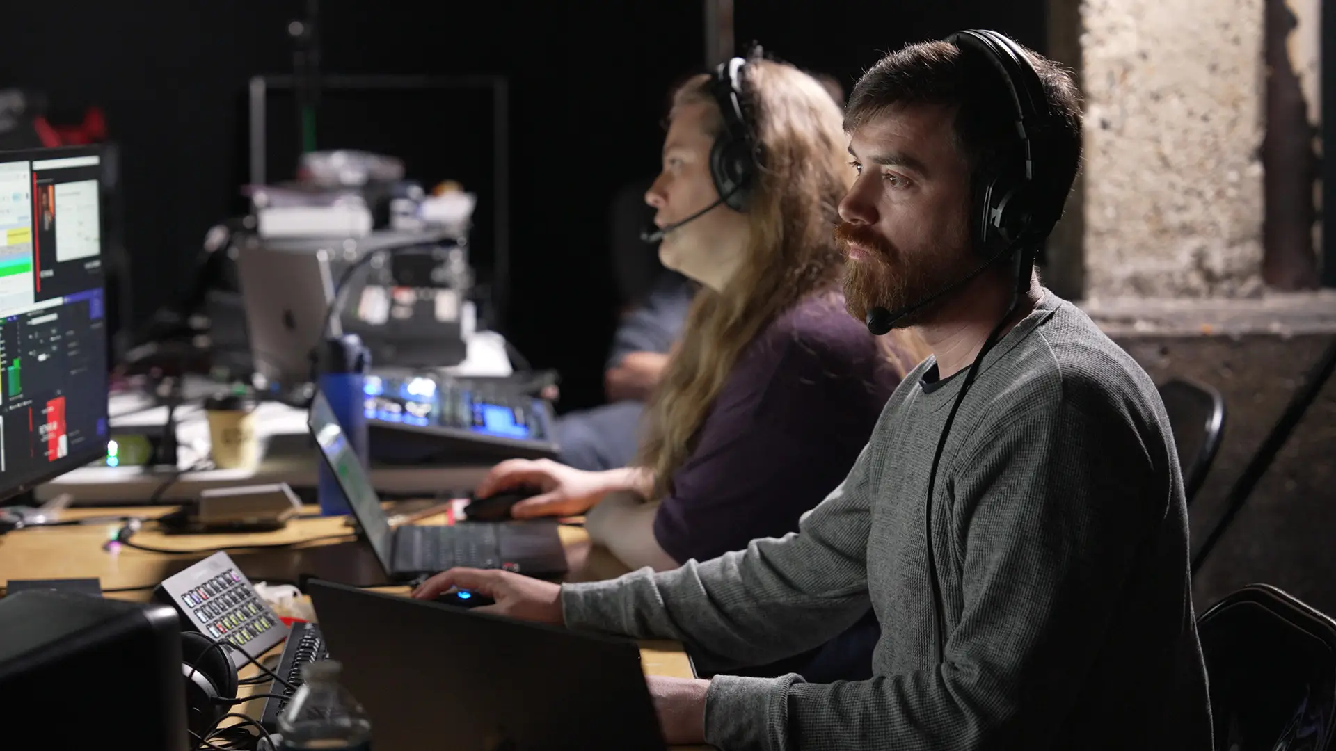 Streaming technicians monitoring live feeds and audio levels from the production gallery during the Wired x Kyndryl event.