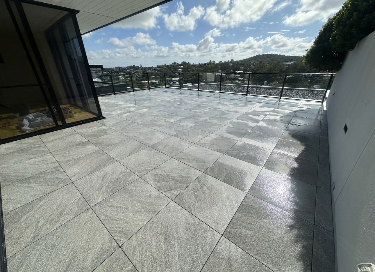 man in black jacket walking on sidewalk during daytime