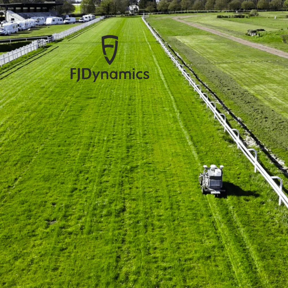 FJD RM21 Rough Ranger mowing striped lines across a large turf field