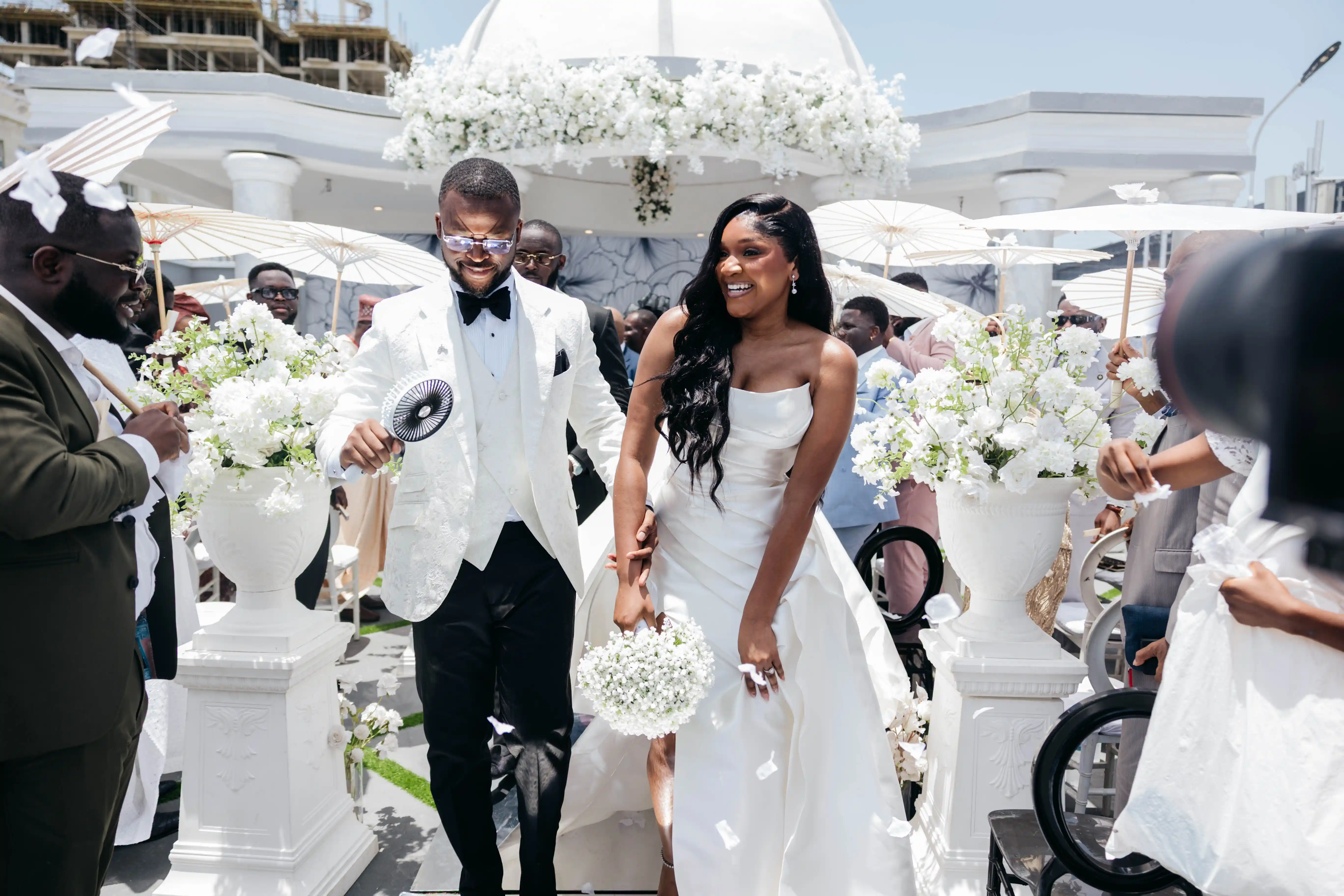 Bride and groom celebrating a luxury wedding coordinated by Victoria Brooks Events, a premium wedding planner in Nigeria.
