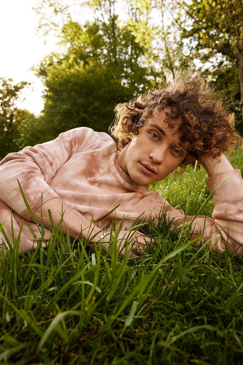 person writing on a piece of paper 