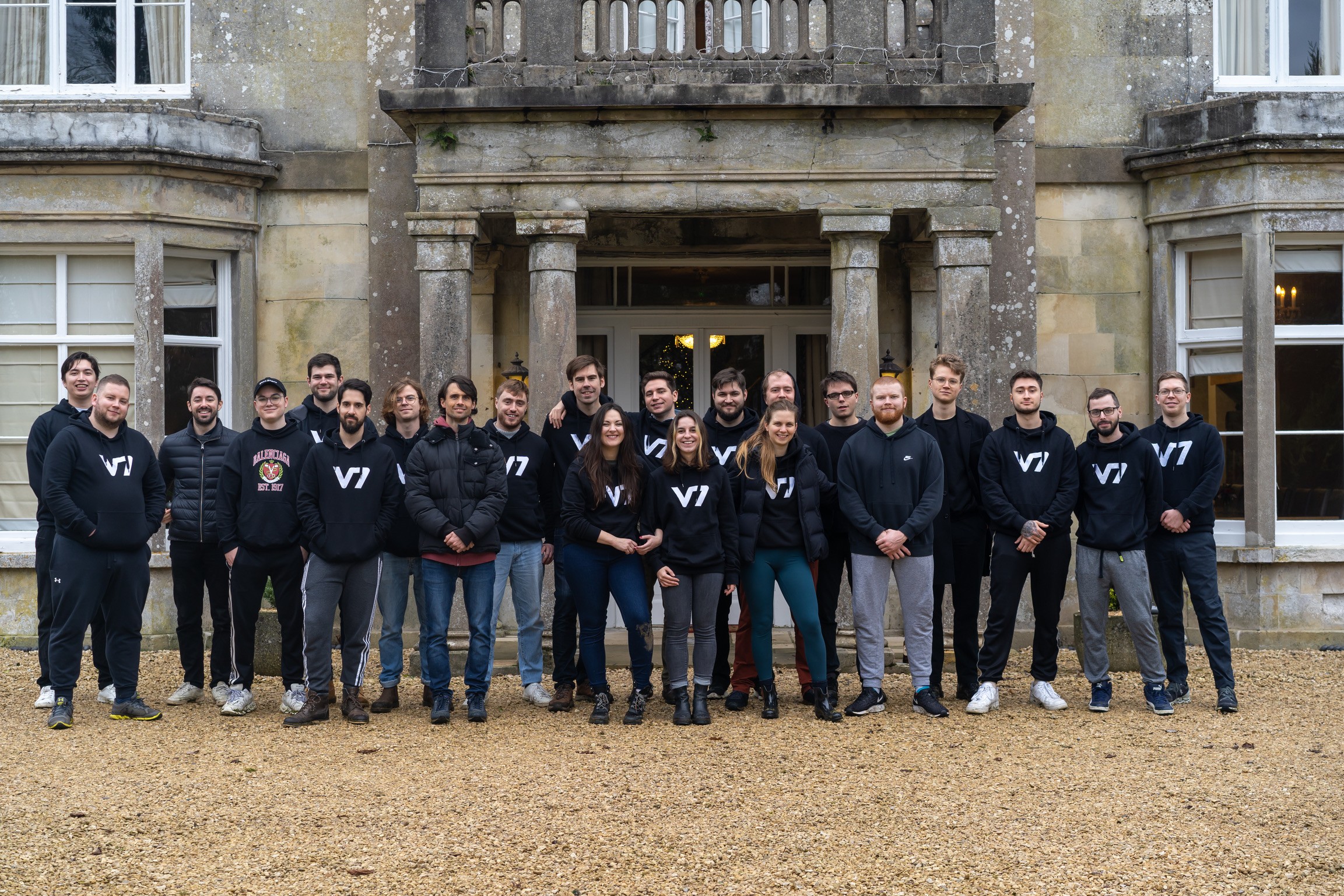 Team outside historic building