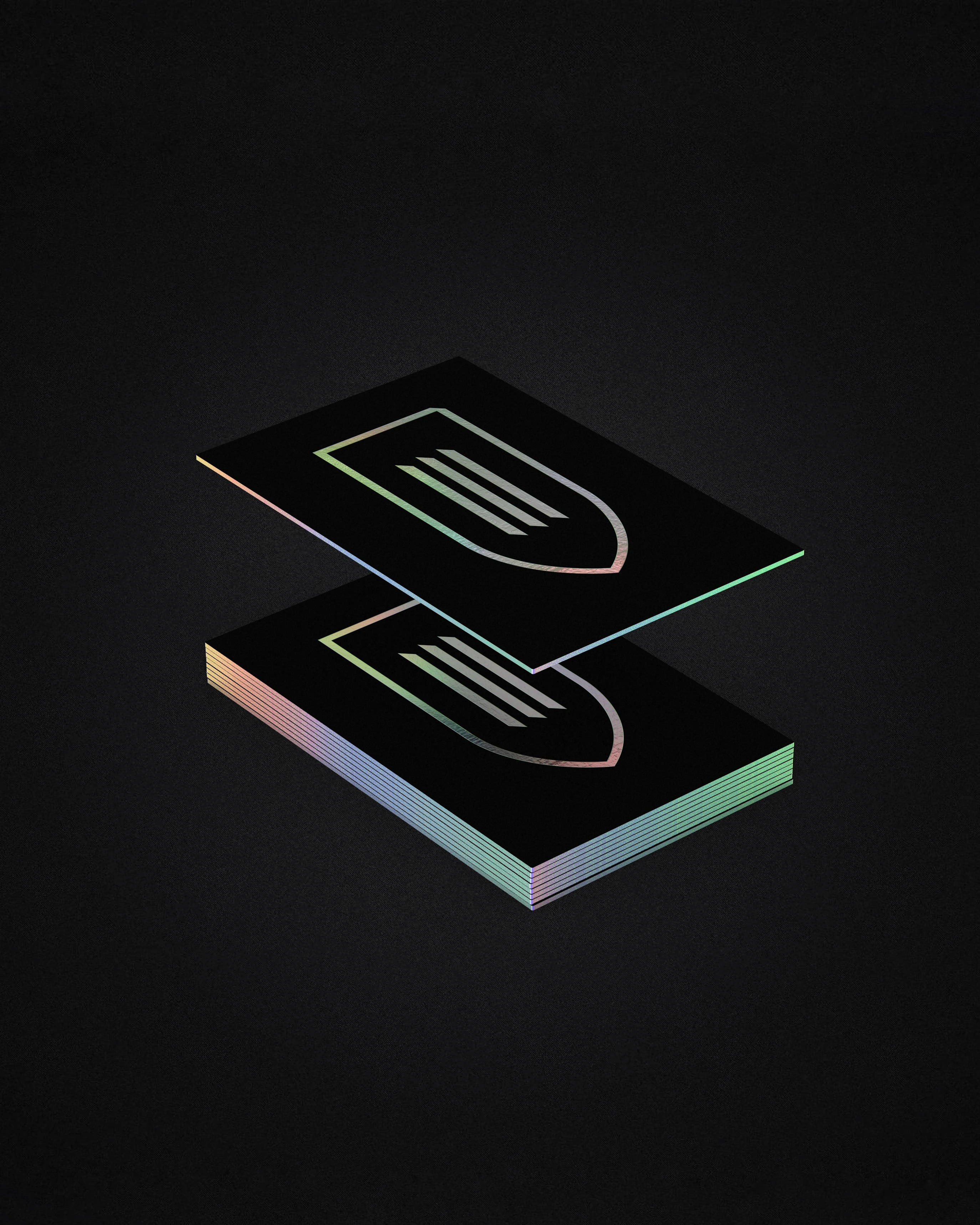 Monduke Productions stacked holographic business cards with gradient shield logo, brand identity design by Sebastian Saavedra