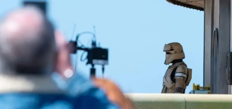 A camera in the foreground looking at a shoretrooper