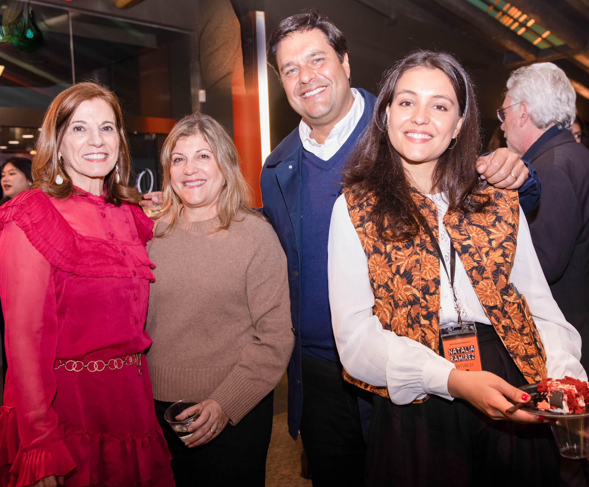 a group of students smiling for the camera in the SVA Theatre lobby after the Venture Forum