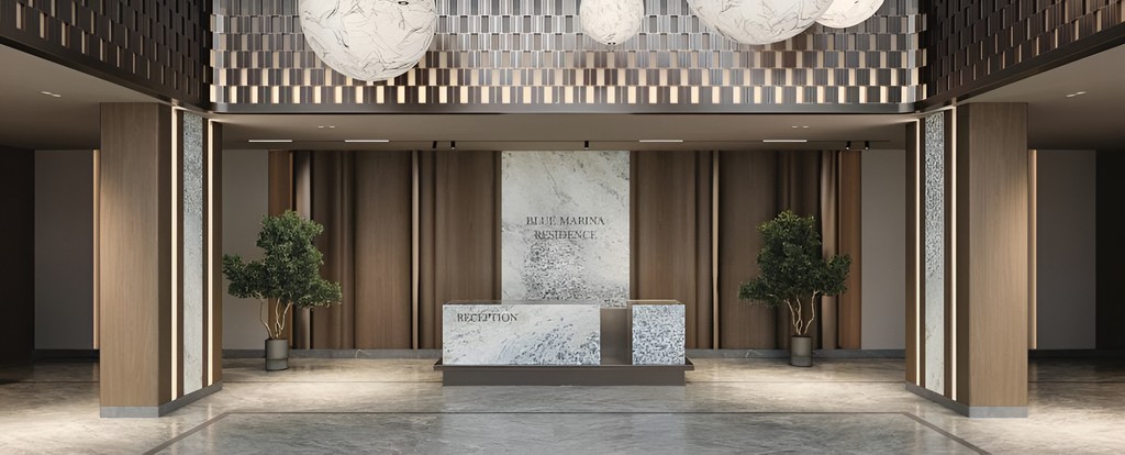 Elegant lobby of Blue Marina luxury apartment building, featuring modern decor and stylish seating areas.