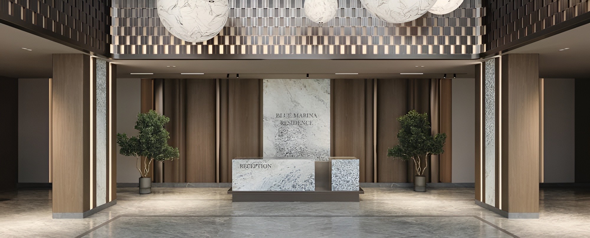 Elegant lobby of Blue Marina luxury apartment building, featuring modern decor and stylish seating areas.