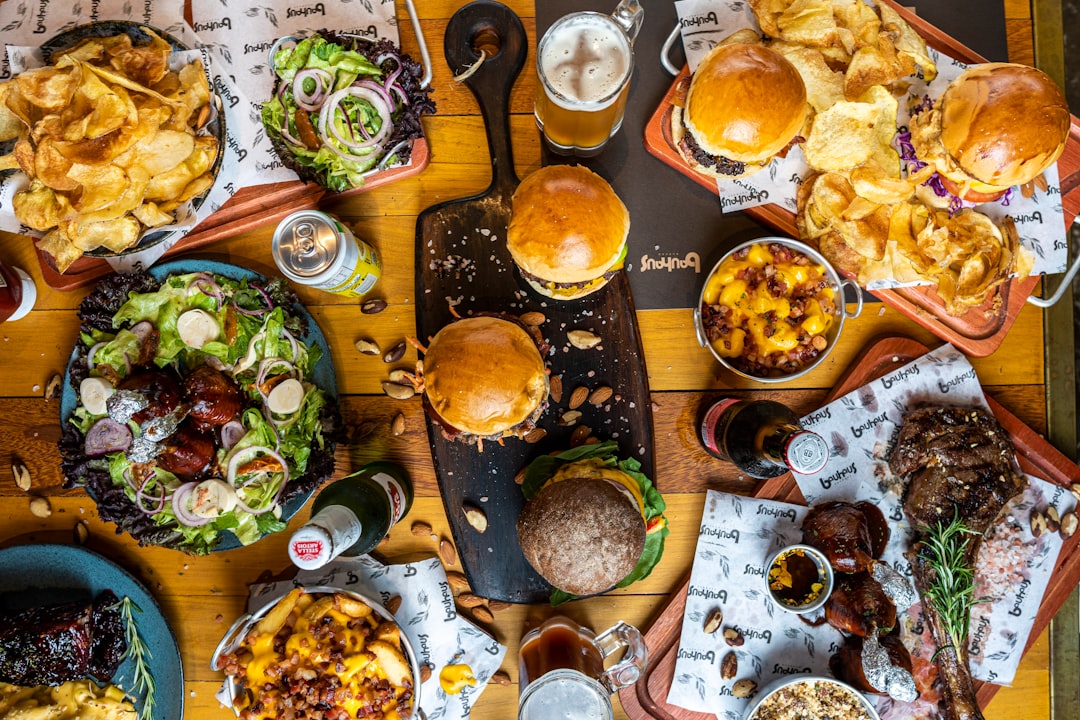 a wooden table topped with lots of food
