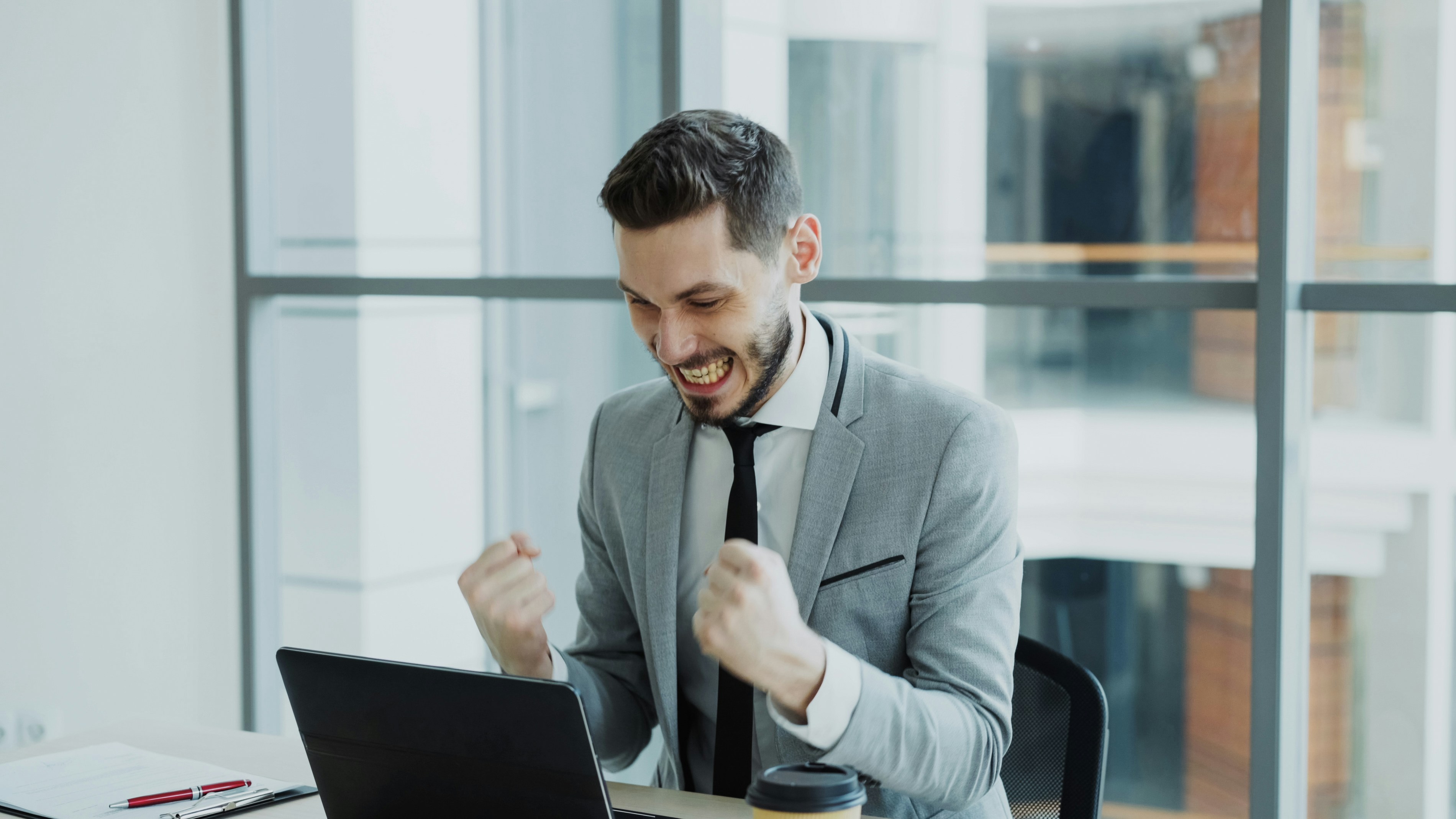 man celebrating success -  How To Improve The Hiring Process