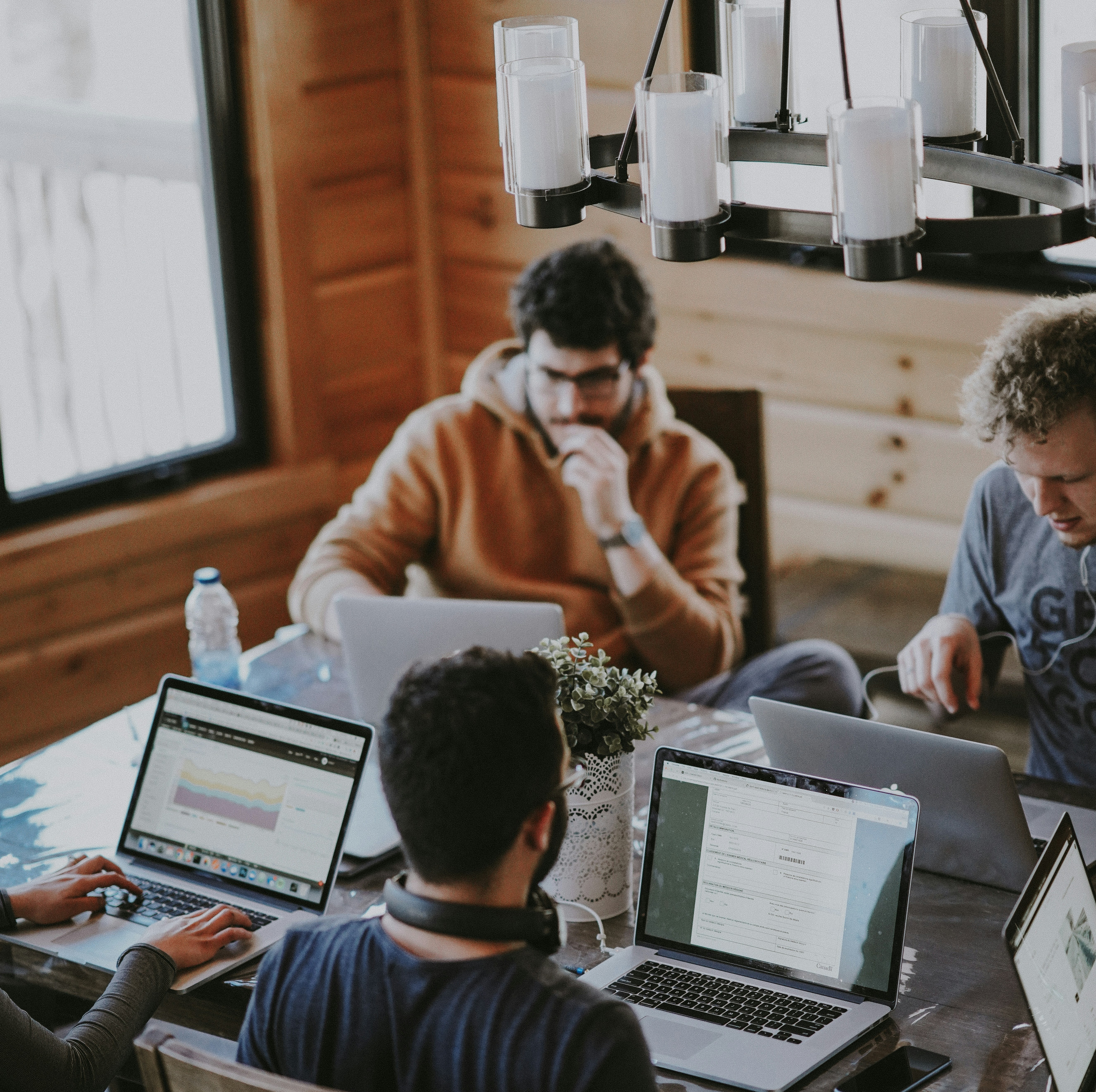 People working on laptops in an office
