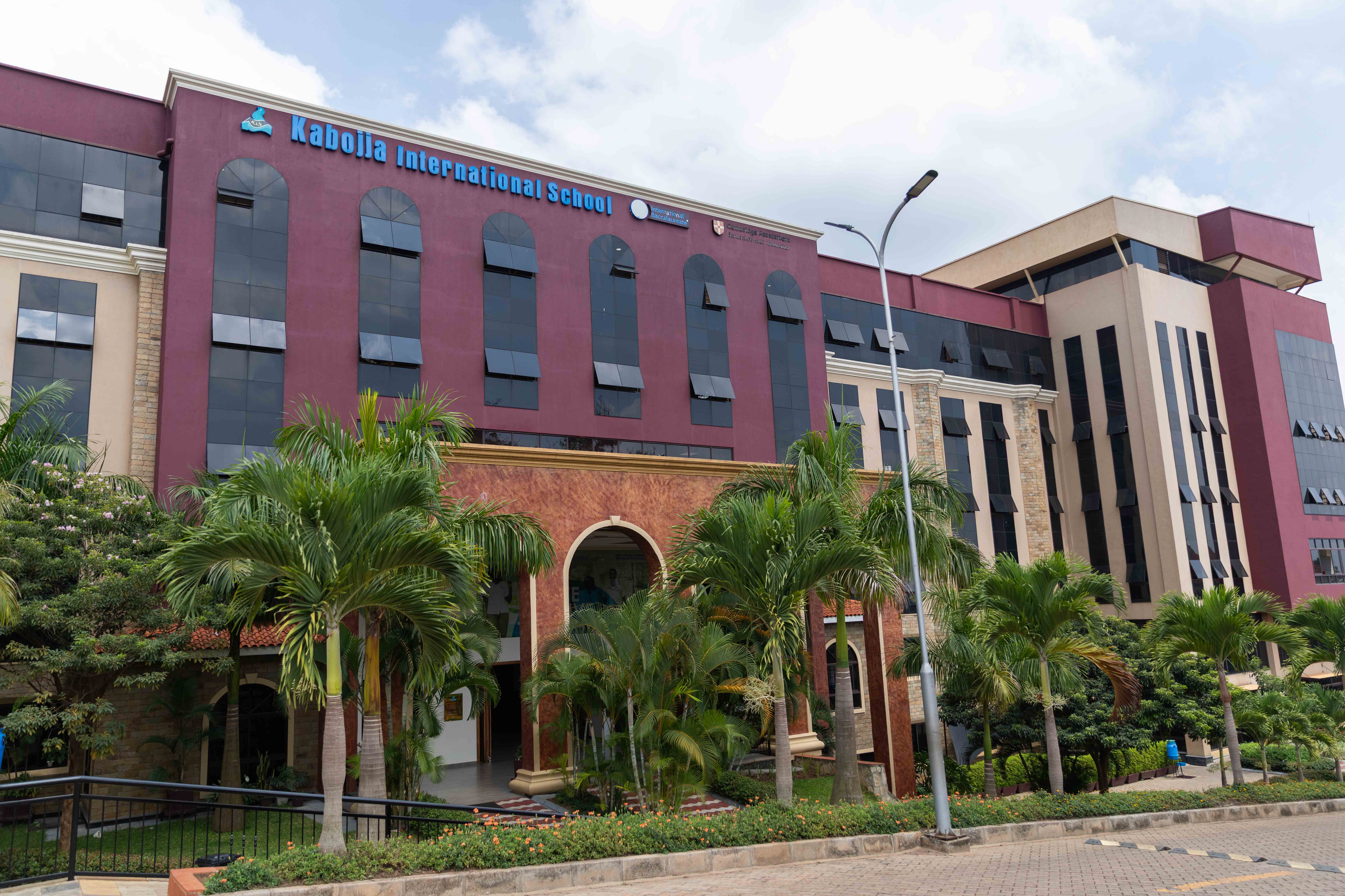 A school building stands against the backdrop of a clear sky