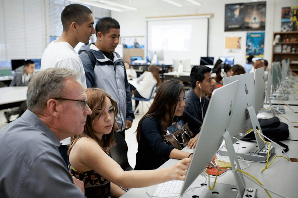 High school student working on a computer science research project with a university mentor in 2026
