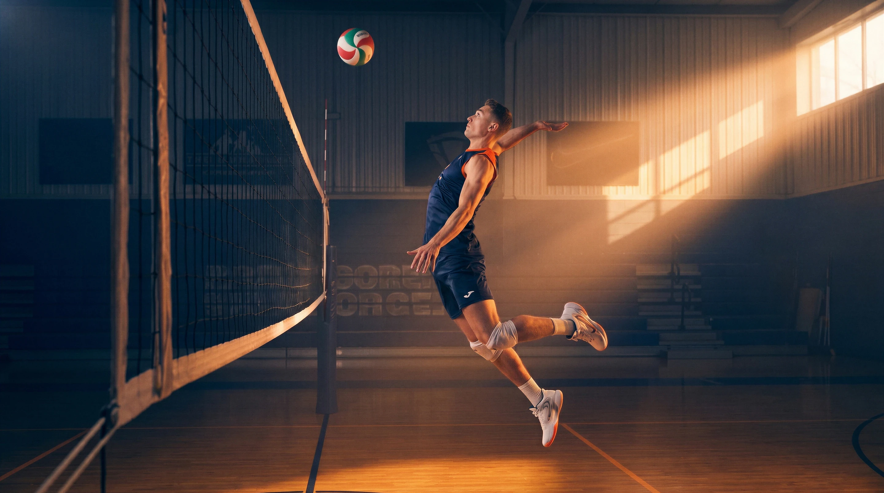 Two volleyball players blocking a spike during a Pianeta Sport Volleyball Tour match