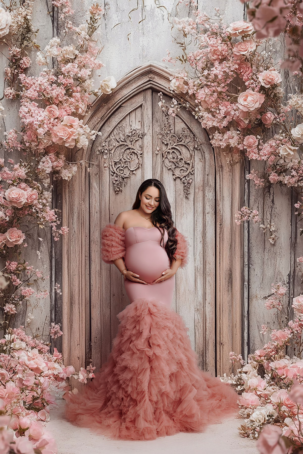 Romantic maternity photoshoot in Orange County — mom in a fluffy gown with soft lighting.