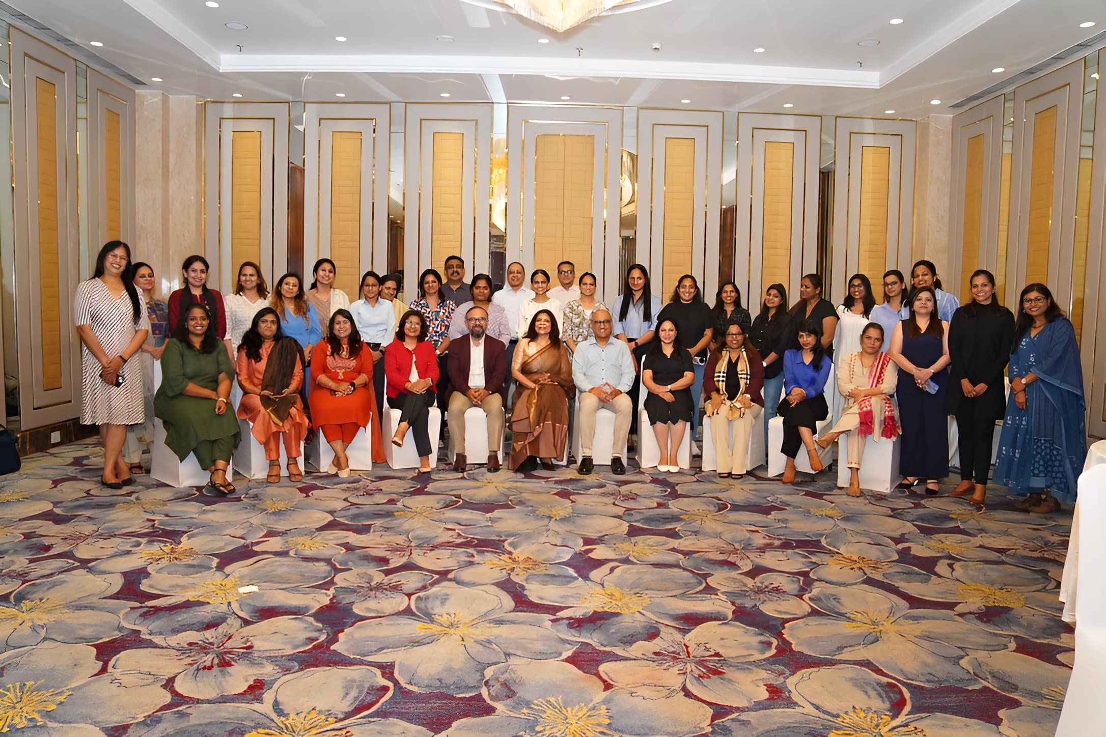 A conference room with people and Mridula Sankhyayan