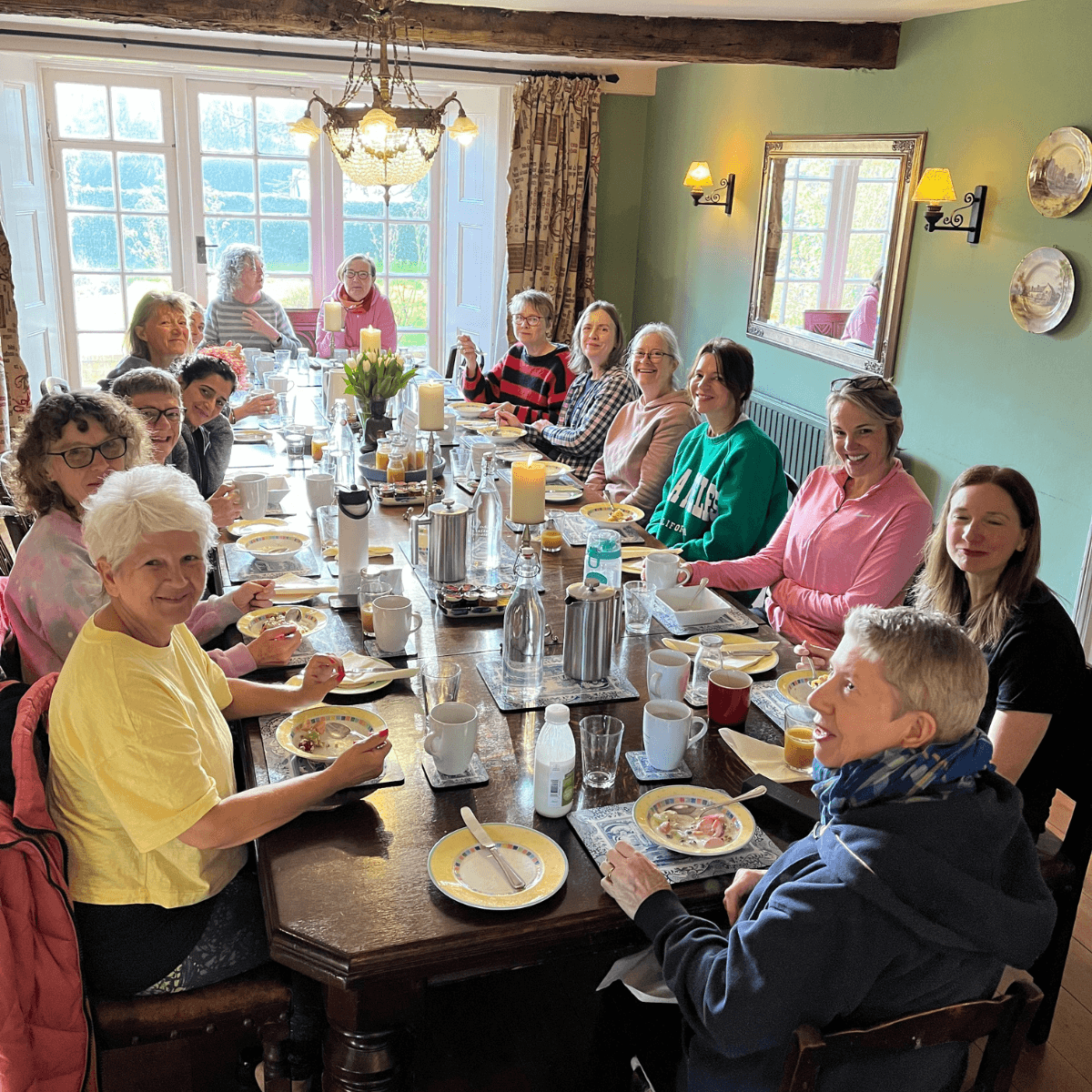 Members enjoying breakfast together at a retreat