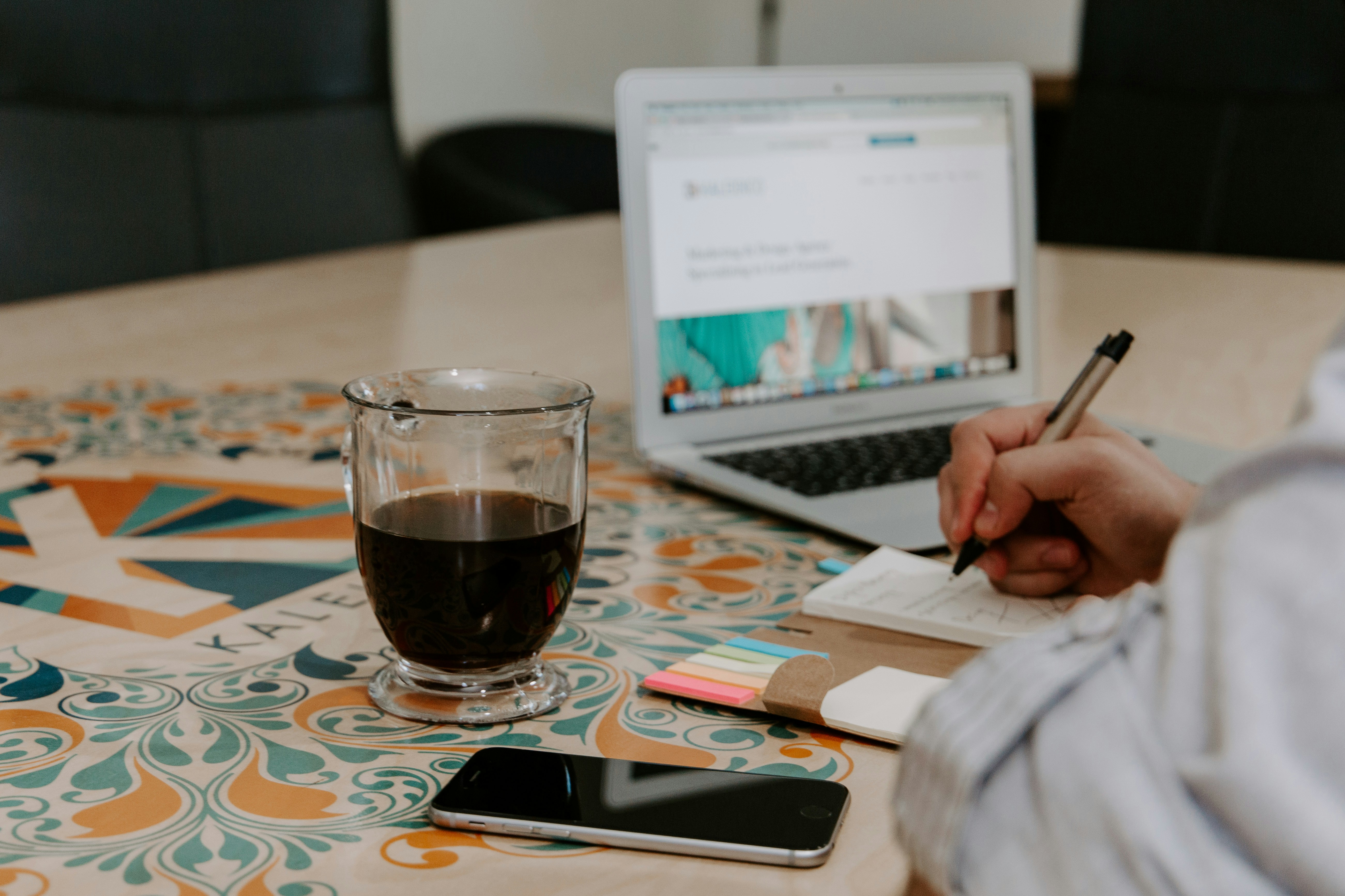 woman writing steps for Personal Knowledge Management