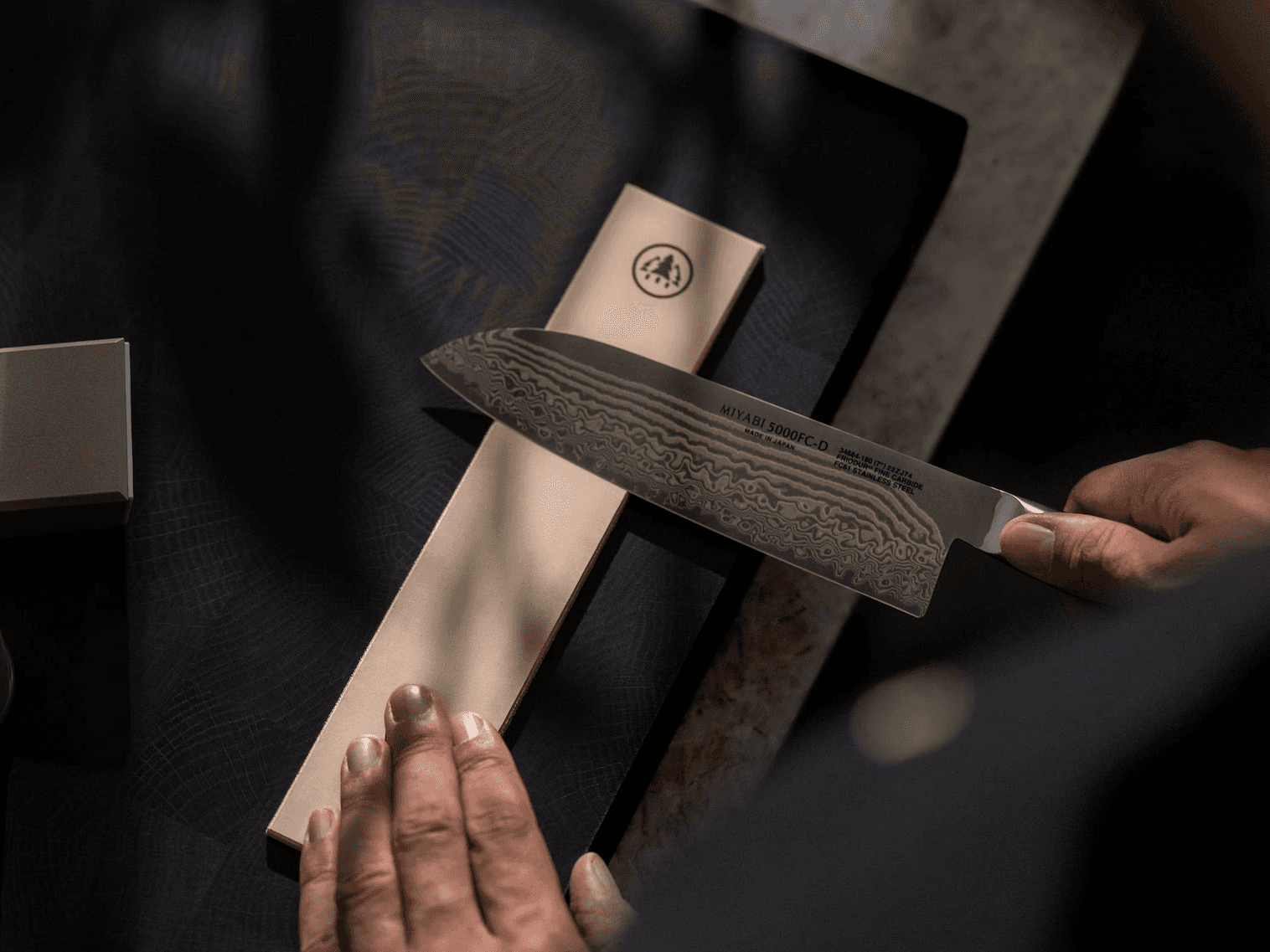 Placing the HORL® Leather Strop on a flat, stable surface in preparation for knife stropping.