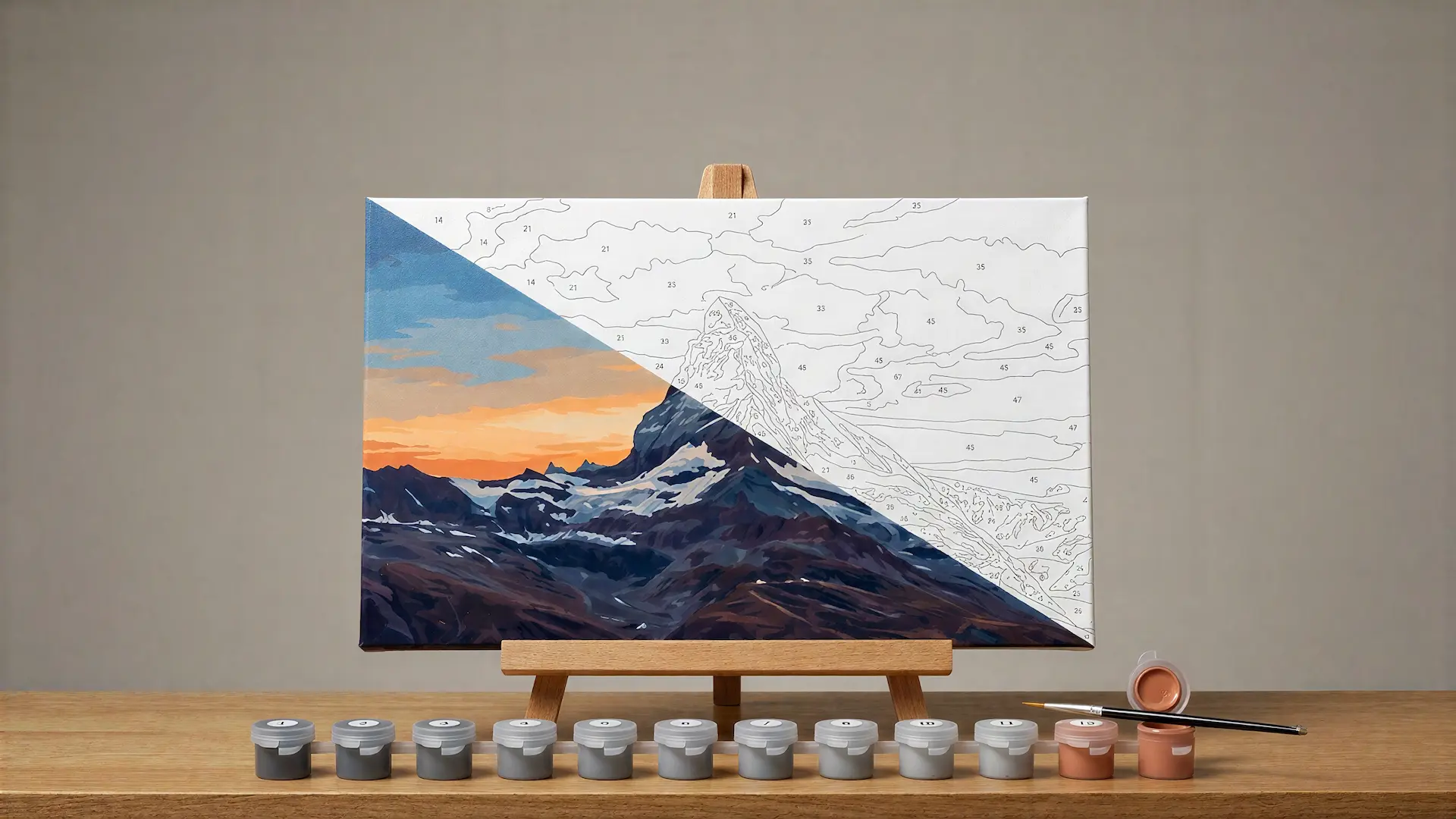 A half-painted paint-by-numbers canvas of a mountain summit, its bare regions still numbered.