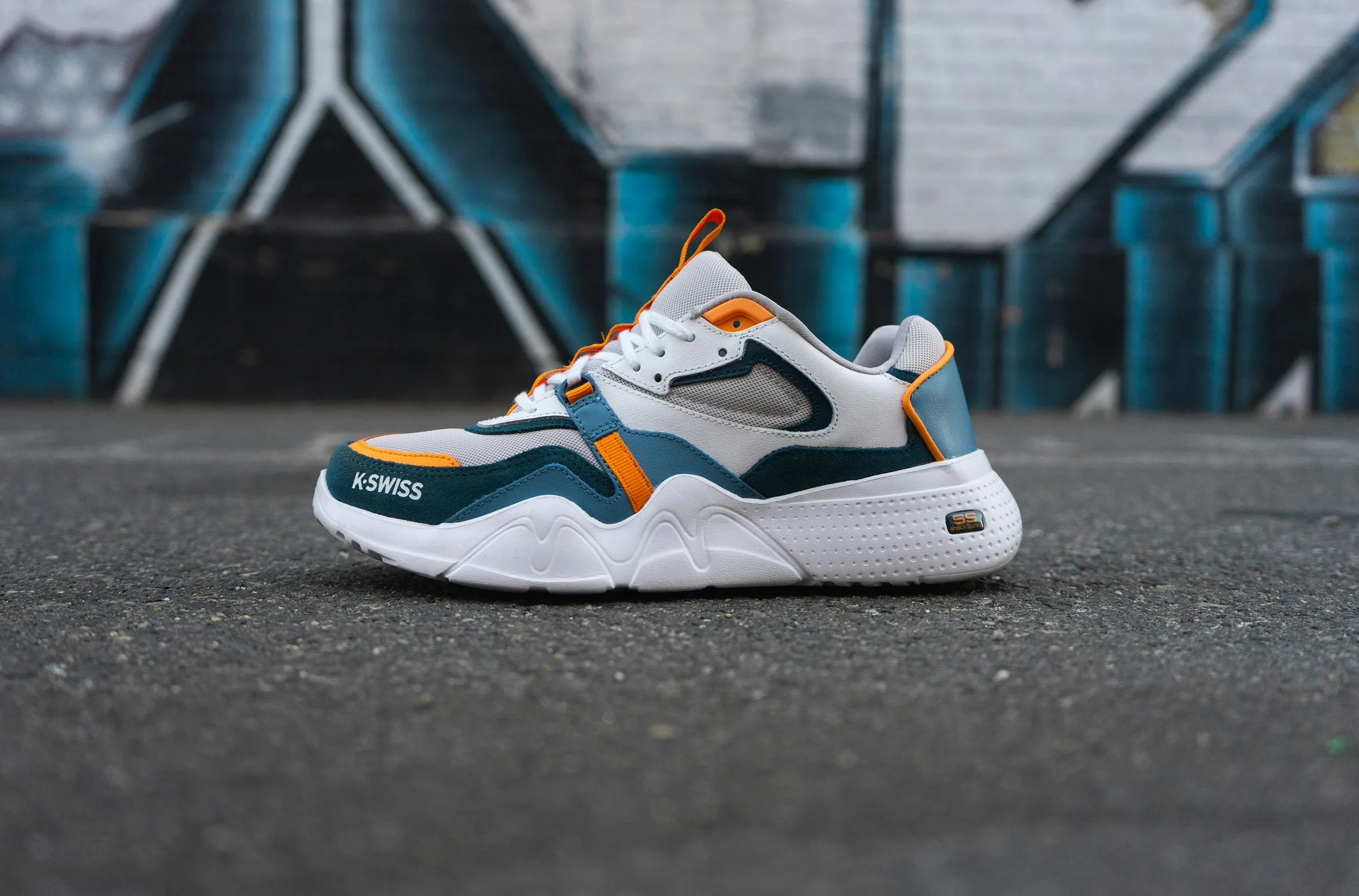 Modern athletic sneaker on concrete surface, urban footwear product photography