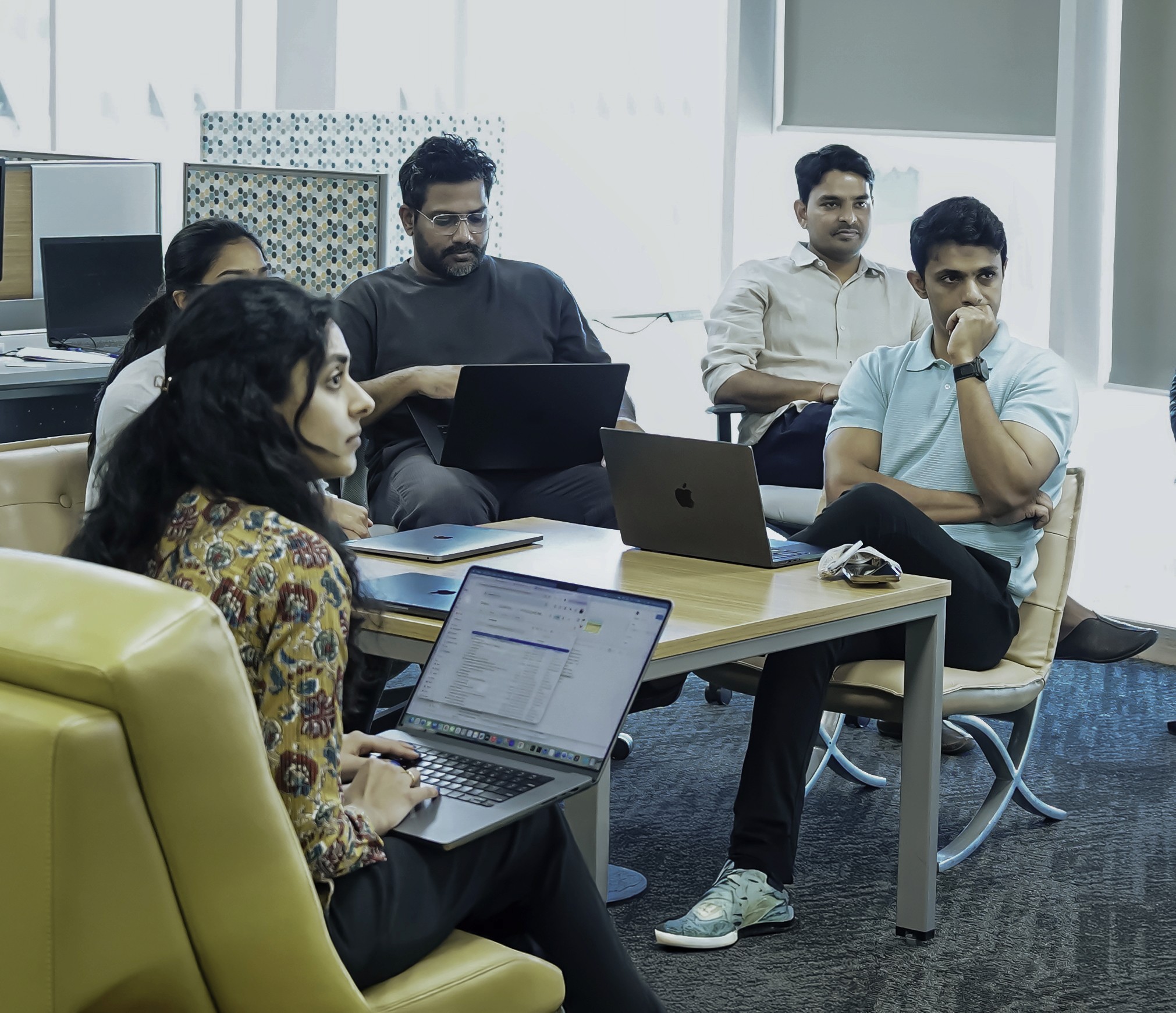 people sitting on chair in front of laptop computers