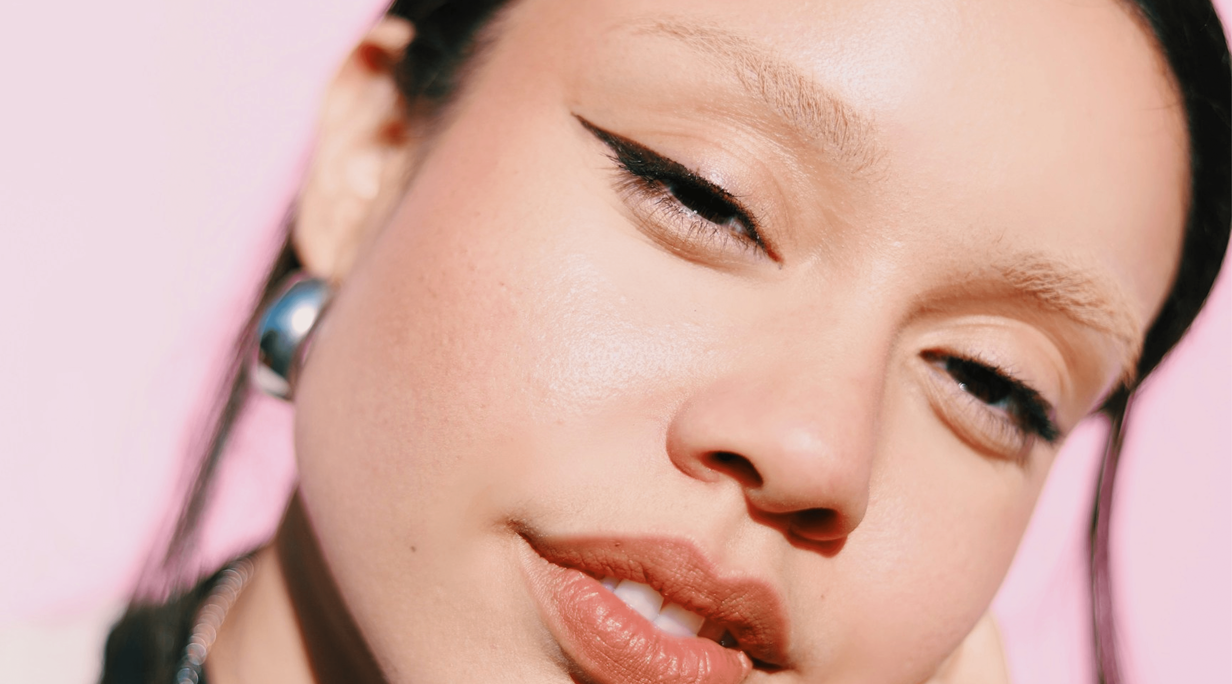 a woman with her hand on her face