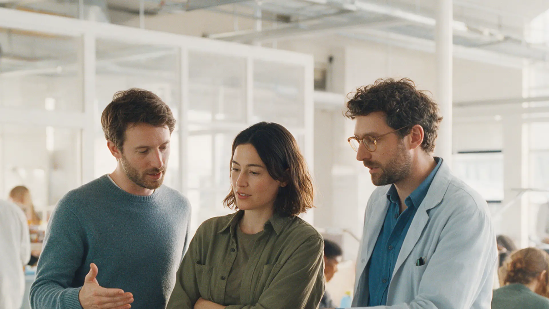 Team discussing results at a laboratory bench