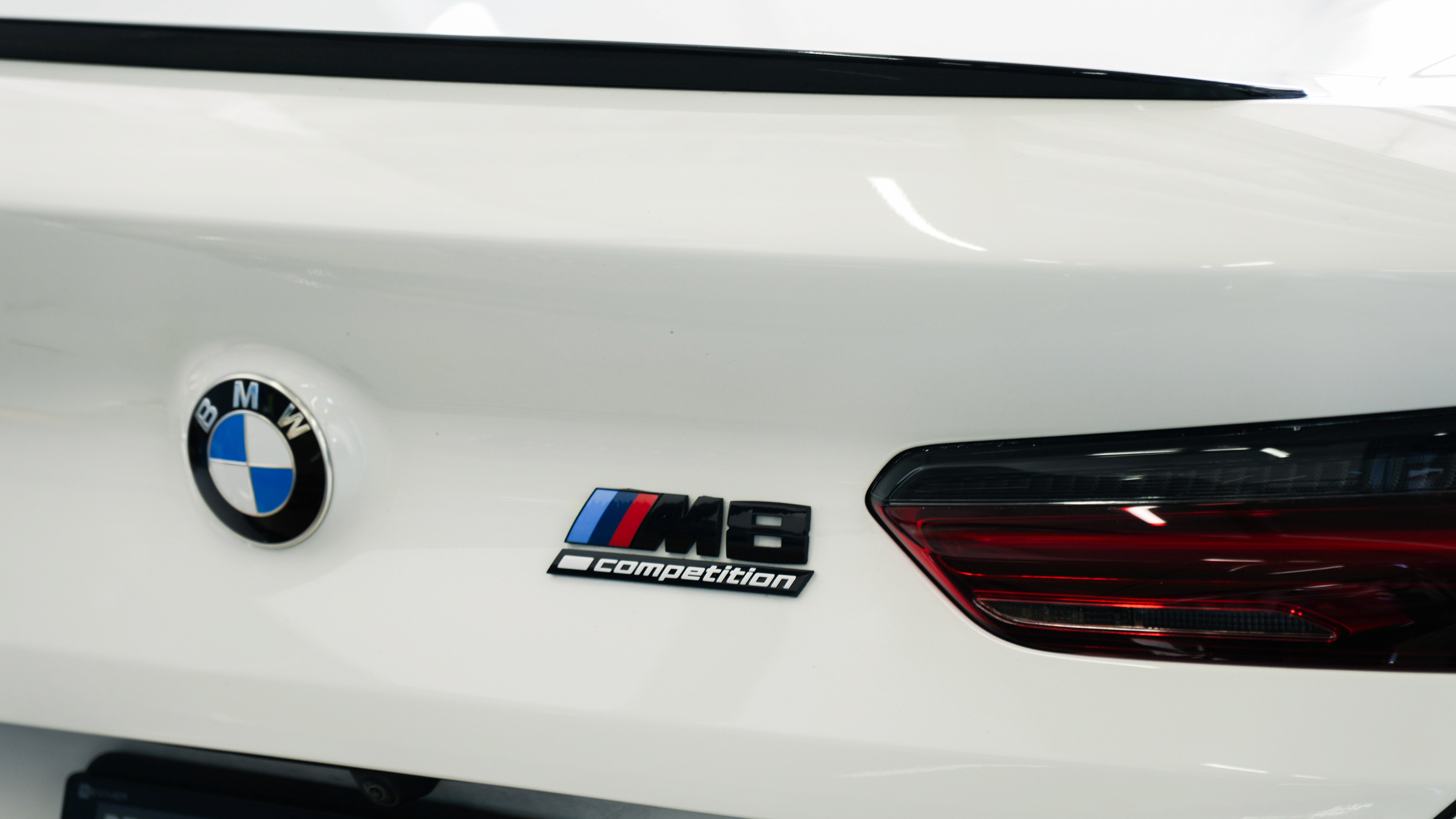 Car parked inside auto repair shop