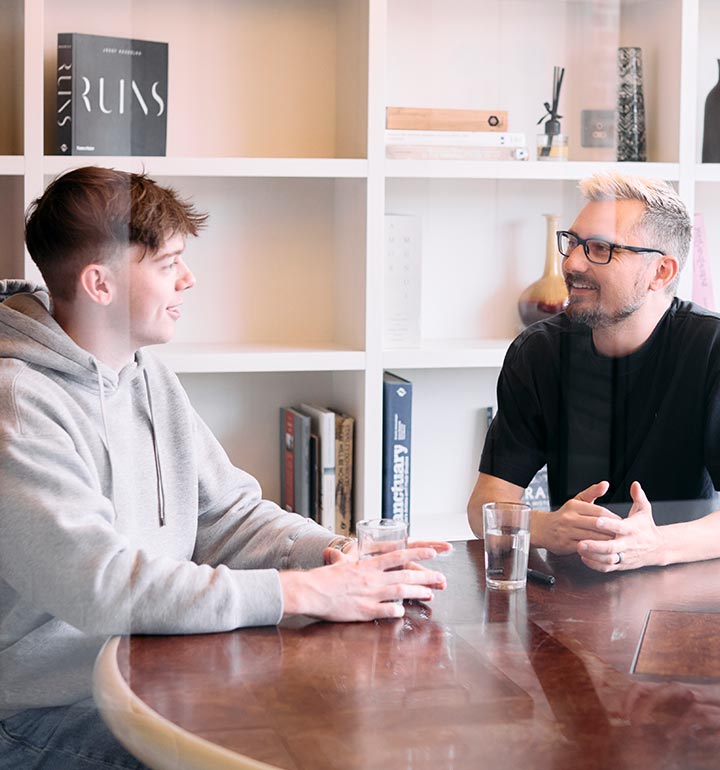 Two members of the Valliance team chatting in a meeting