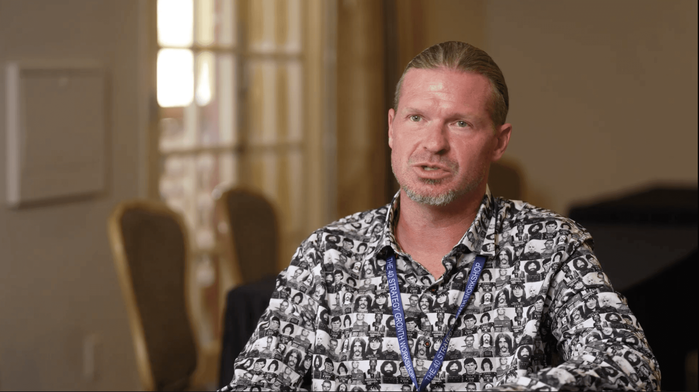 a group of people in a room with a projector screen