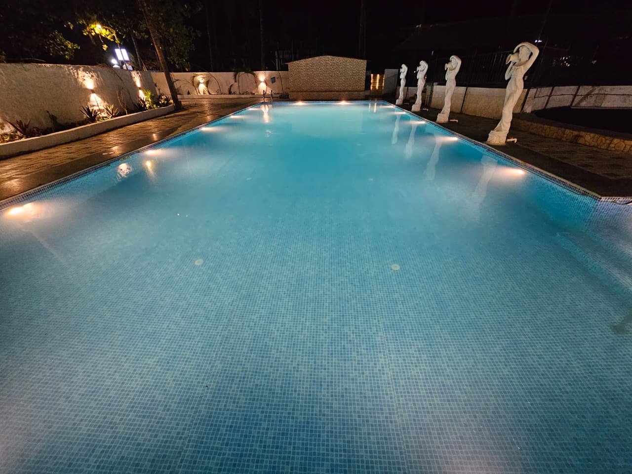 Swimming pool at Wavelash Resort in Gorai.