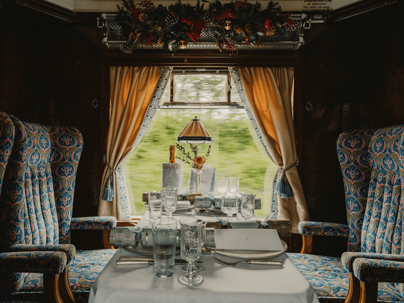 an aerial view of a baseball stadium with a city in the background