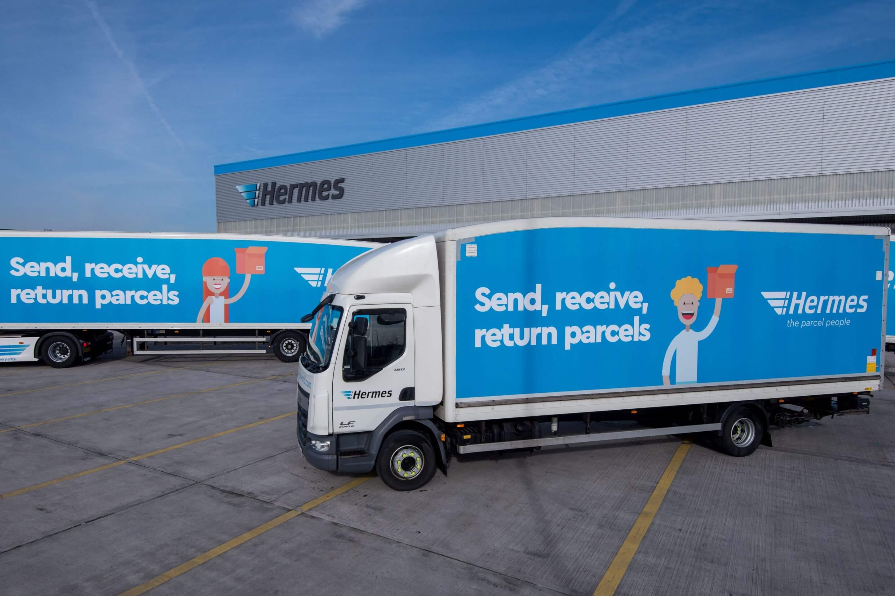Hermes delivery trucks outside distribution center