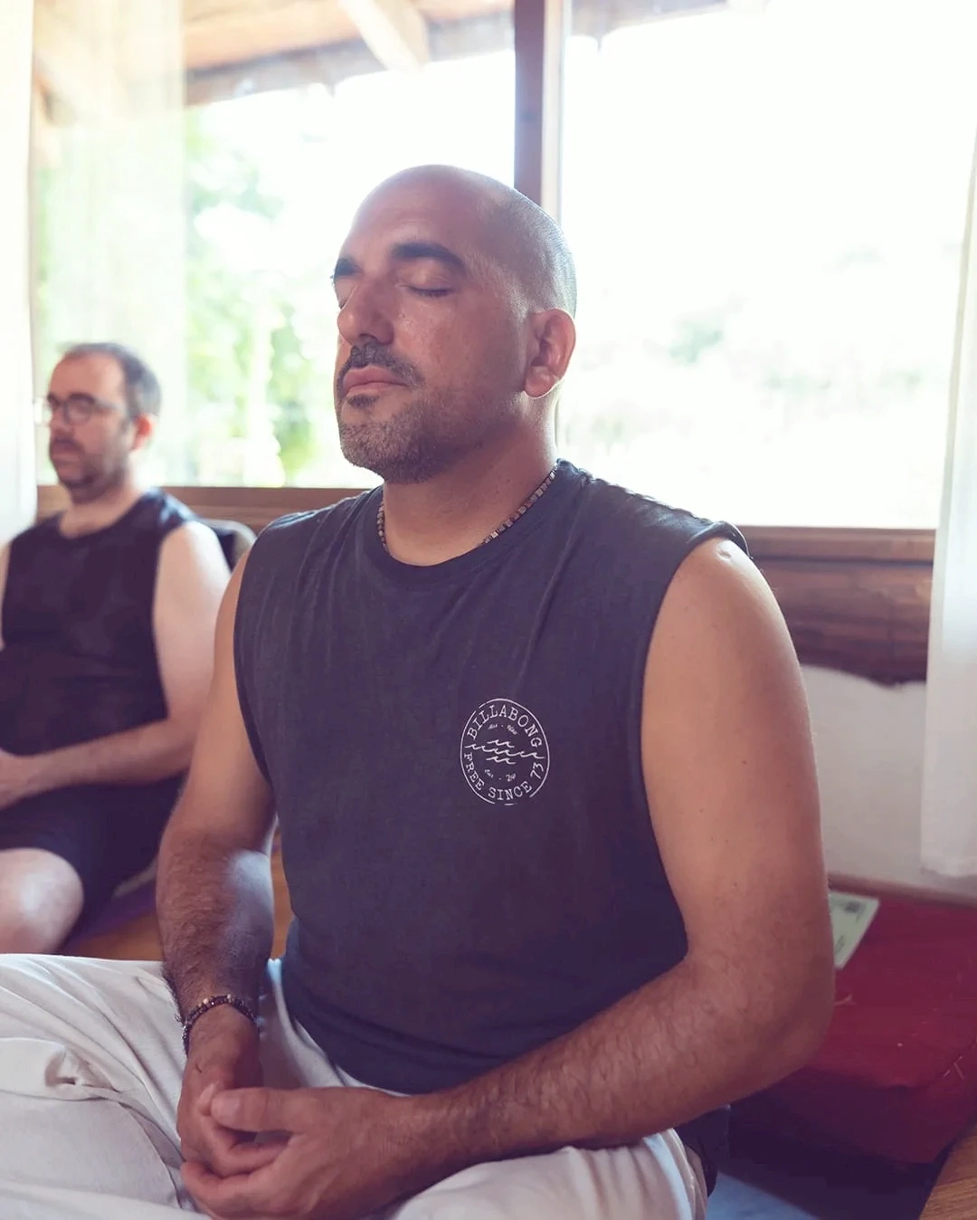 a man seating in meditation position