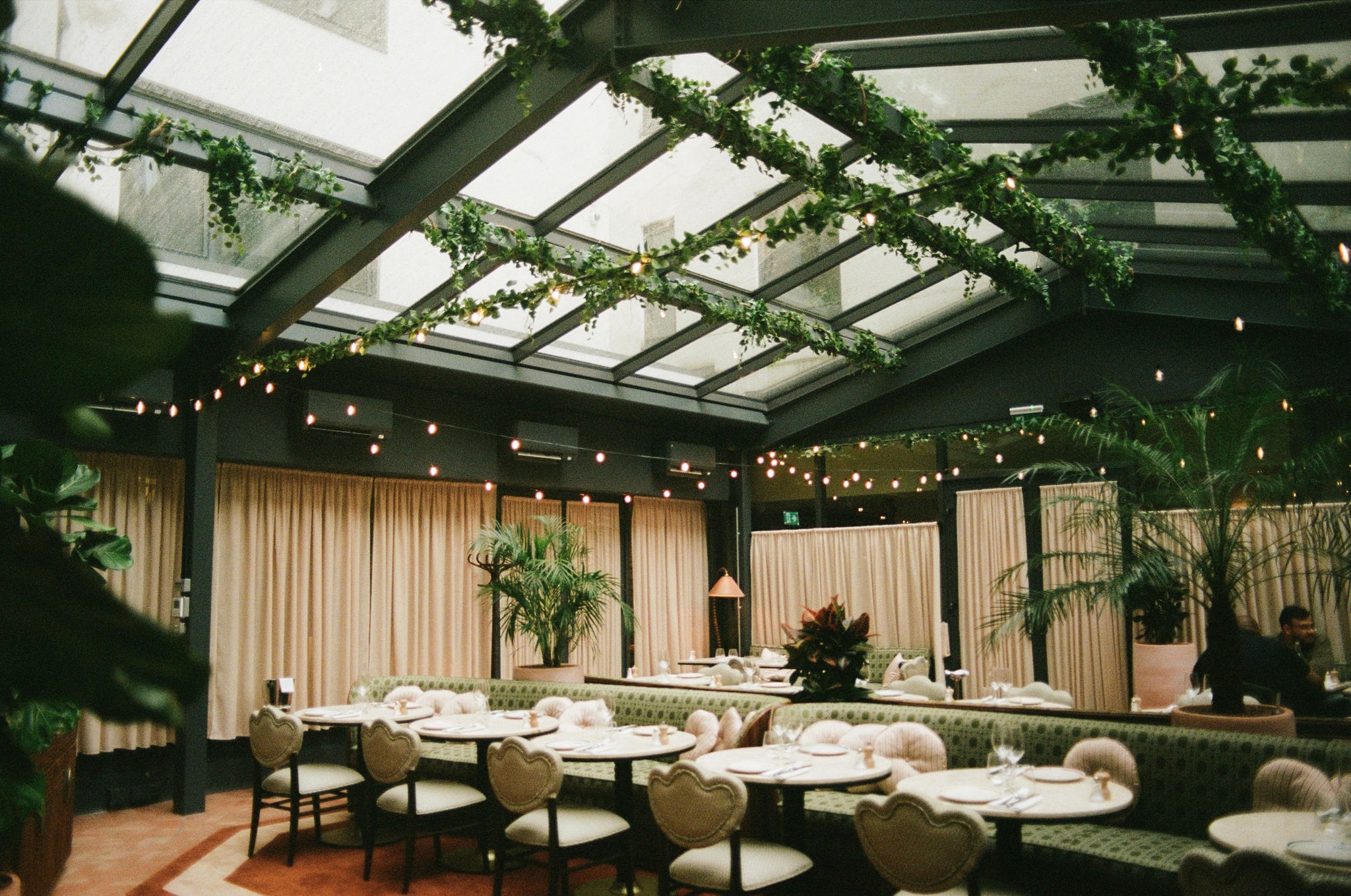 Modern skyscrapers line a busy highway in a sprawling city.