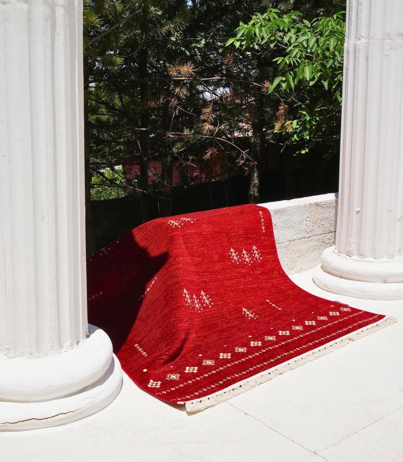 Woman in a beige turtleneck by an old computer and TV, retro 80s office portrait.