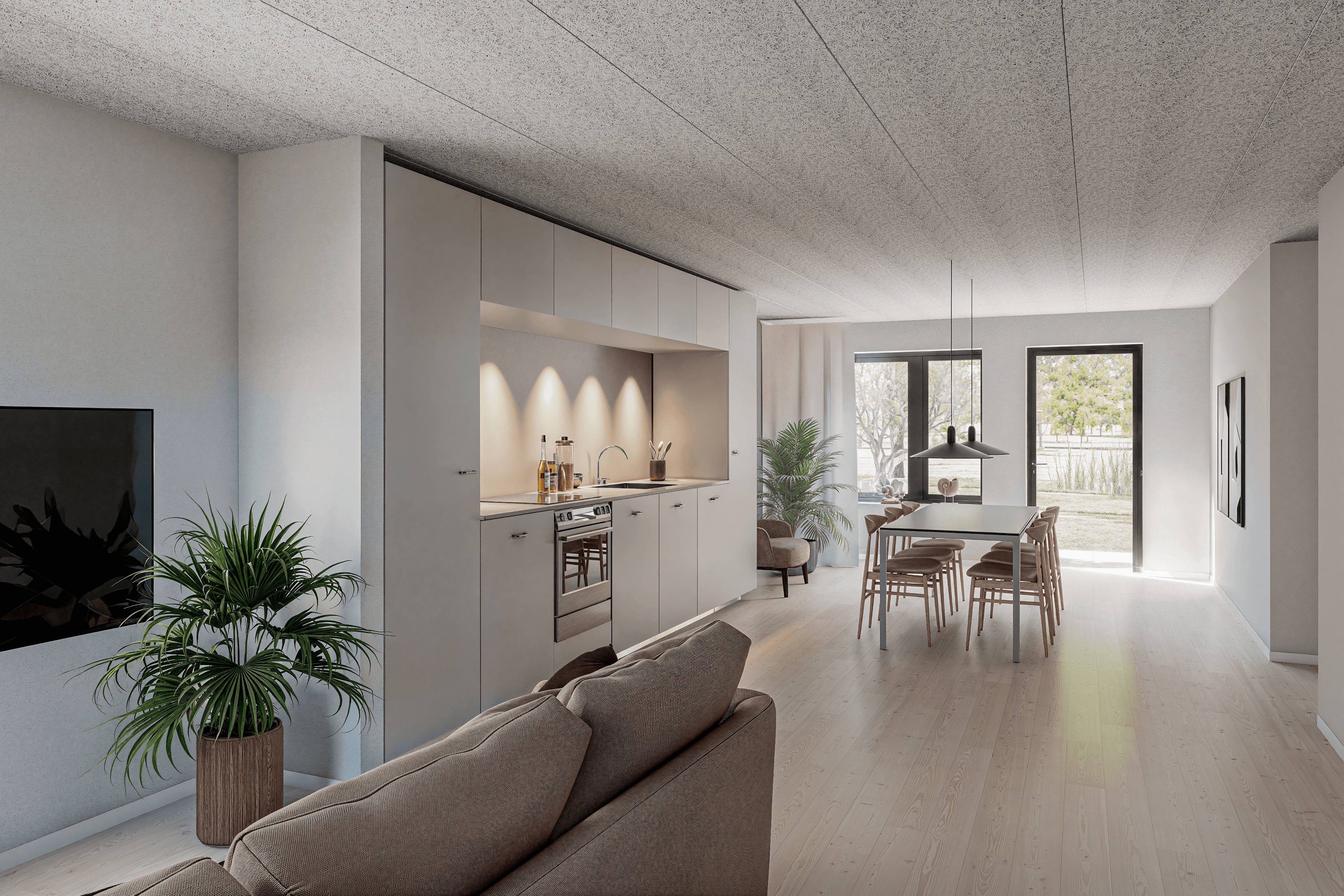 Modern glass buildings with illuminated facades and trees on a rainy day