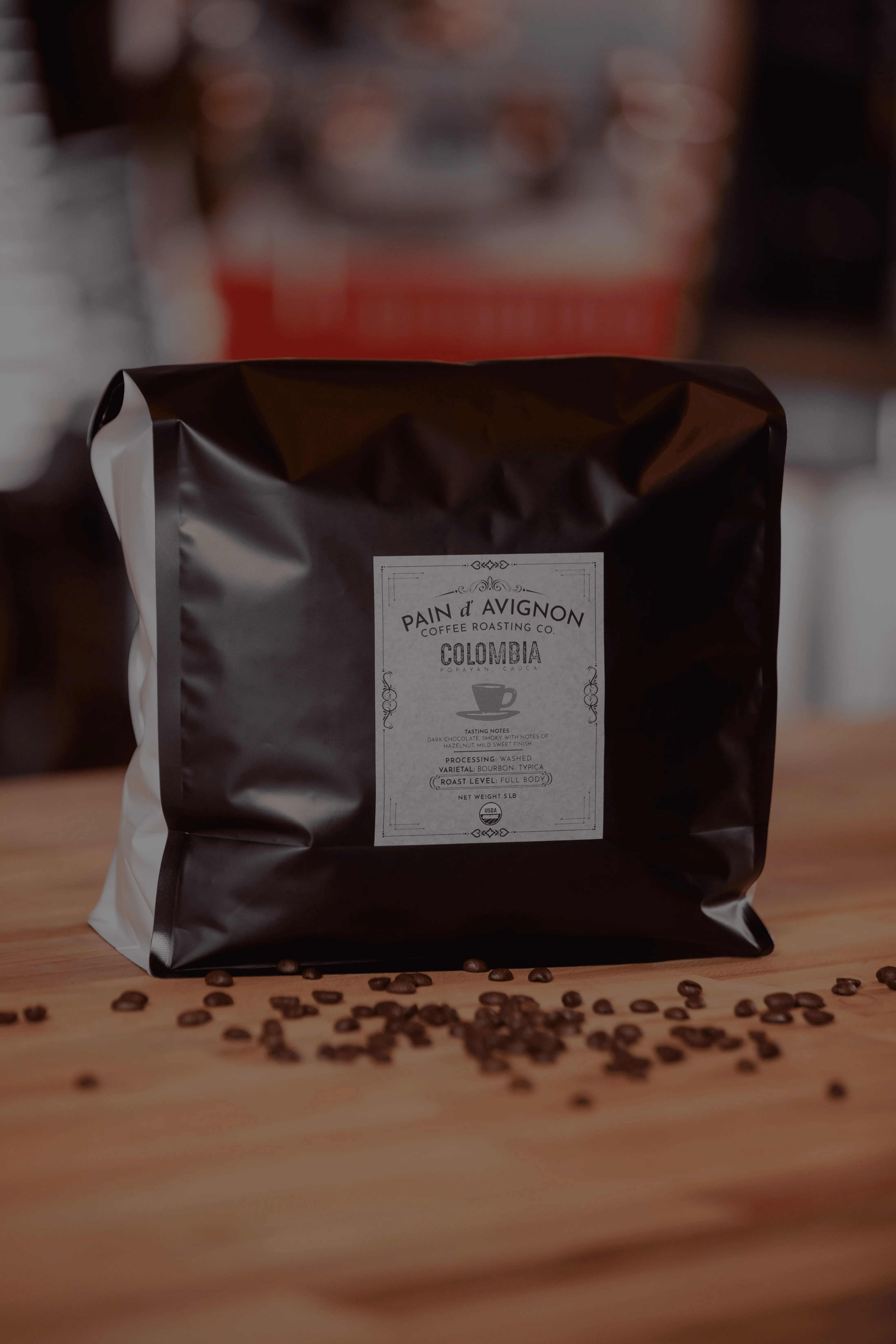 Pain d'Avignon Coffee Roasting Co. Colombia House blend — dark bag with branded label, filter roast with floral, citrus and berry notes